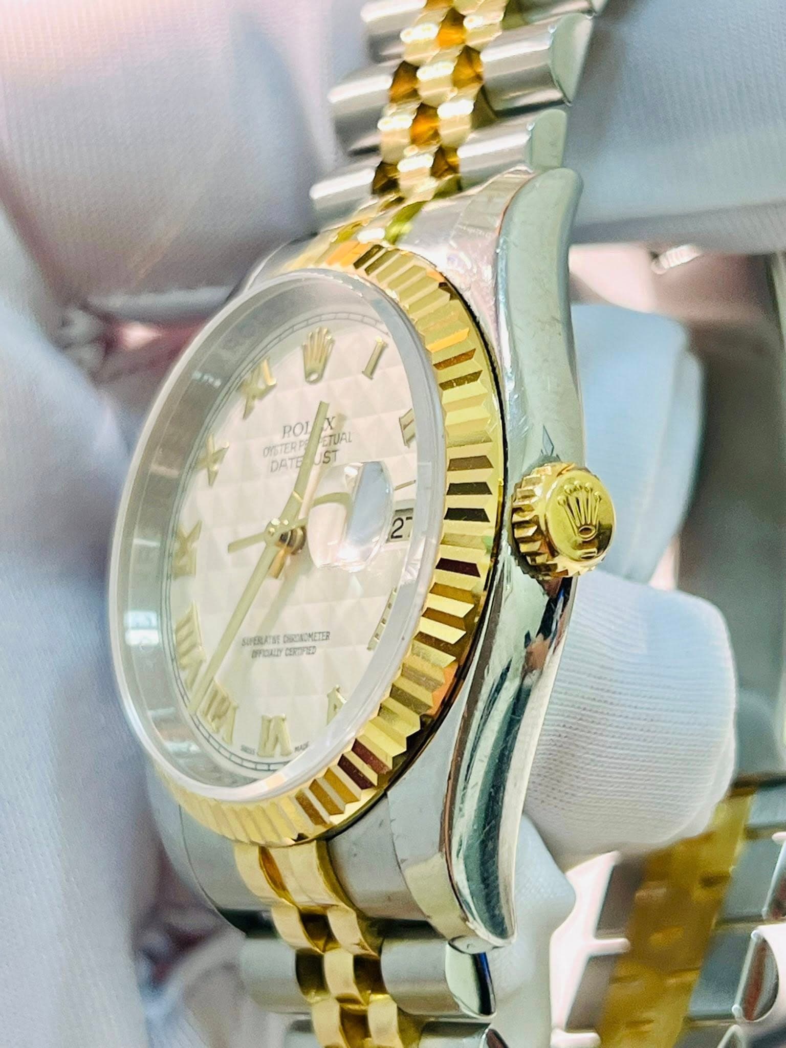 May be an image of wrist watch and text