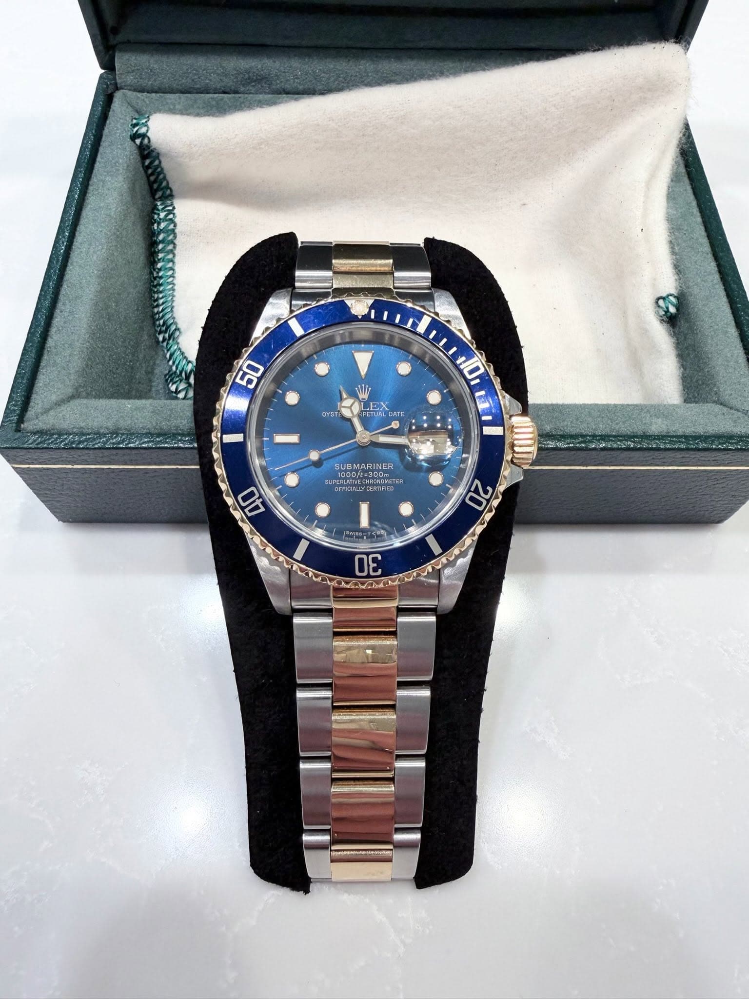 May be an image of wrist watch and text