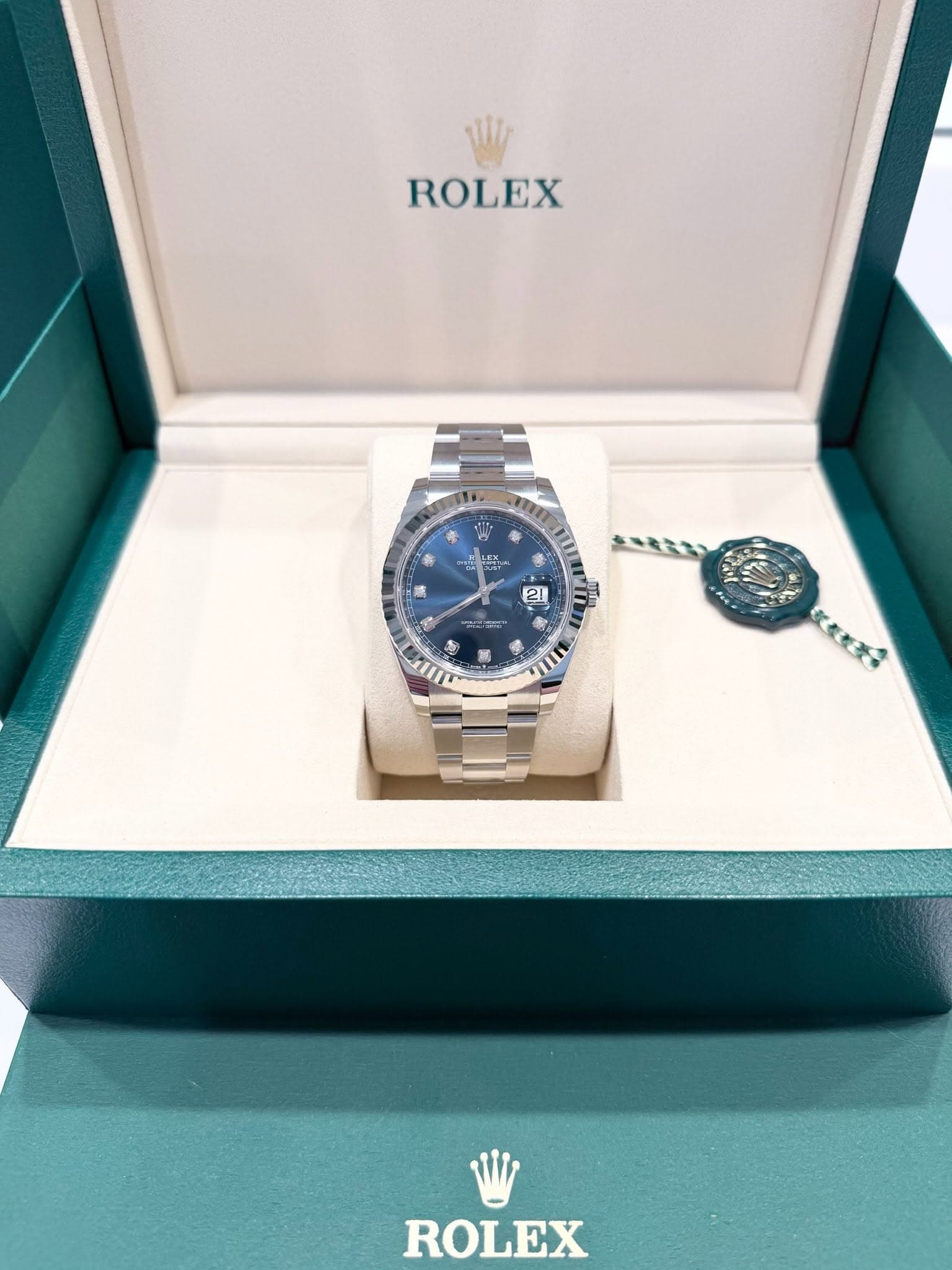 May be an image of wrist watch and text that says 'W ROLEX LS 21 5 SAIII ROLEX'