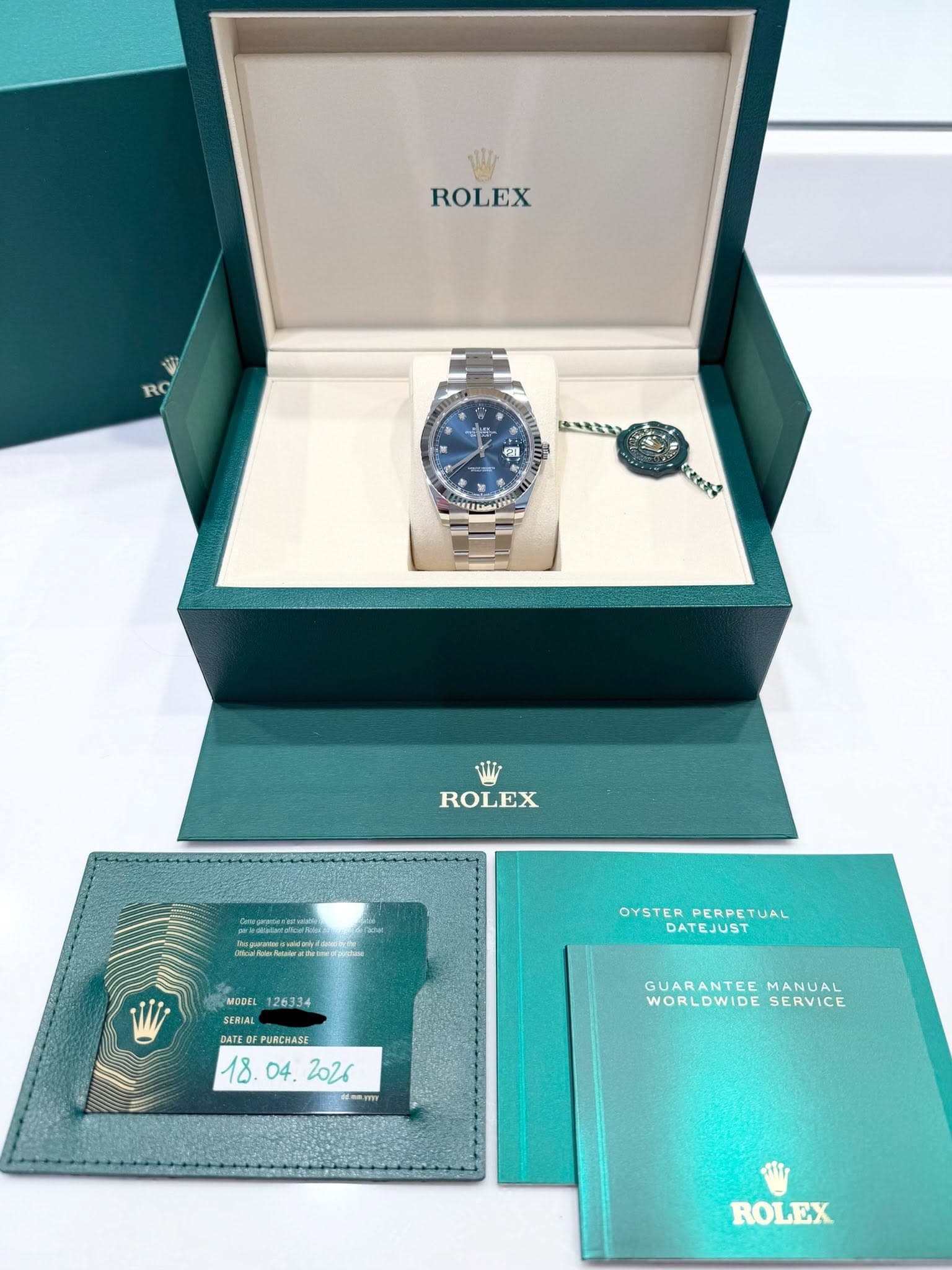 May be an image of wrist watch and text that says 'ROLEX جري ஐ 초제조 米果ム MAT ያ ROLEX Kлиueoй ban OYSTER OYSTERPERPETUAL PERPETUAL DATEJUST 126334 SERIAL BATED BATEBEPURCRASE…