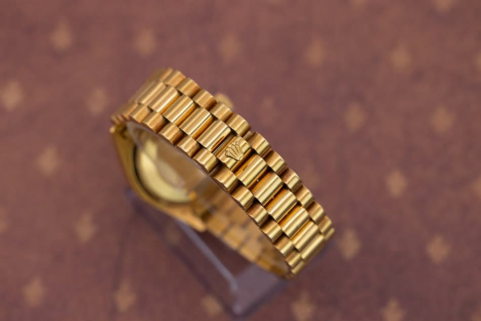 May be an image of wrist watch and jewelry