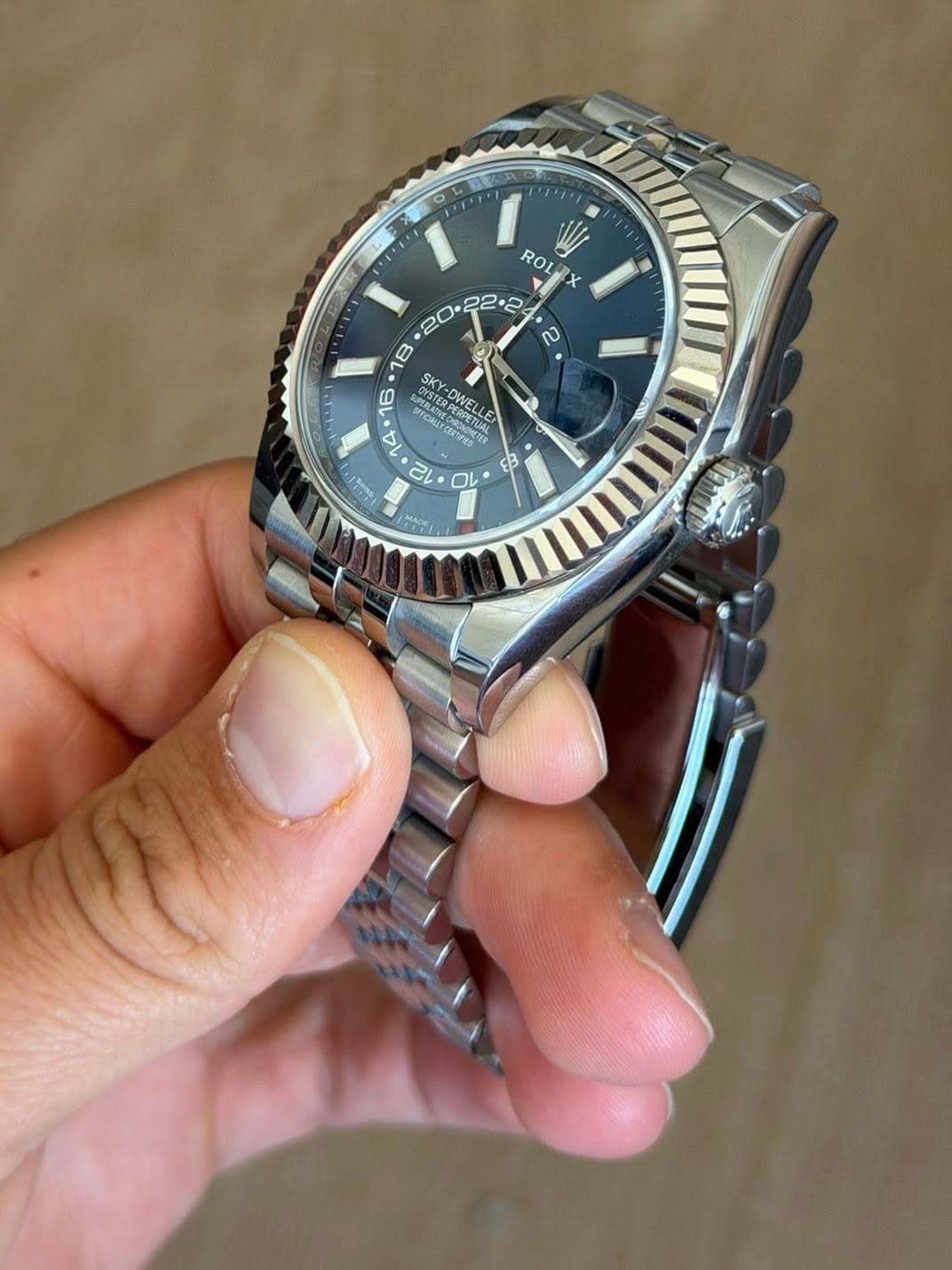 May be an image of wrist watch and text