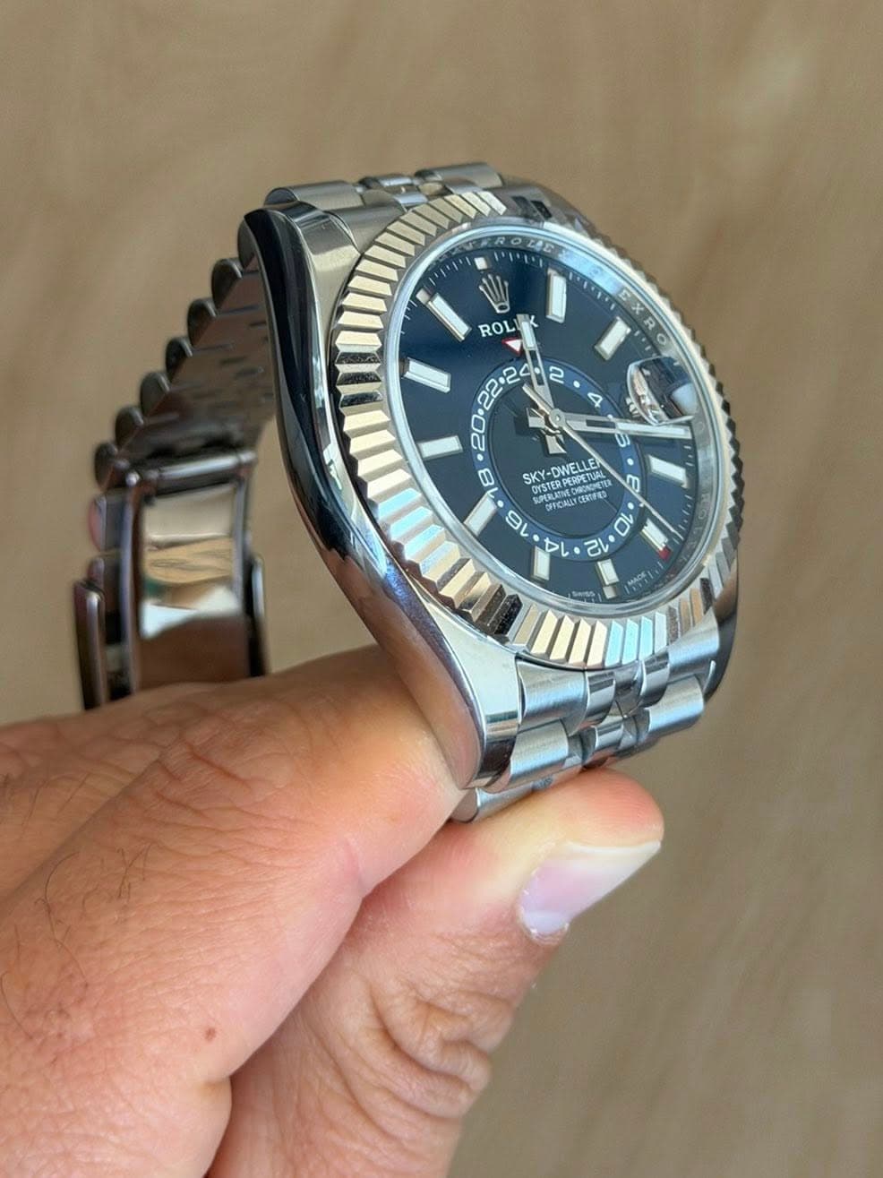 May be an image of wrist watch and text