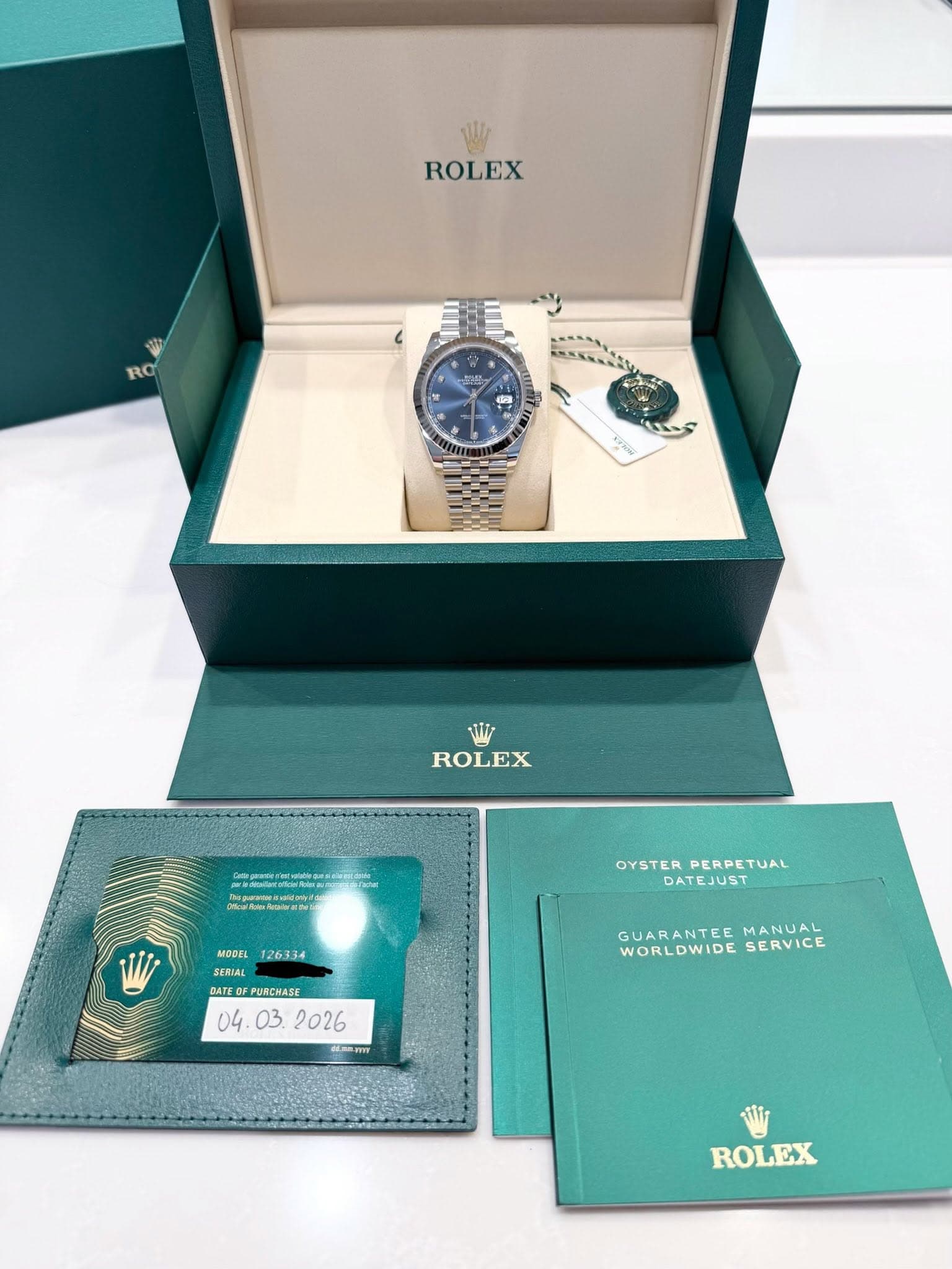 May be an image of wrist watch and text that says 'ROLEX RO WW ROLEX OYSTER PERPETUAL OYSTERPERPETUAL FUAL DATEJUST MODEL MODFL126334 126334 SERIAL SERIAL DATE PURCHASE .TIY RFY…