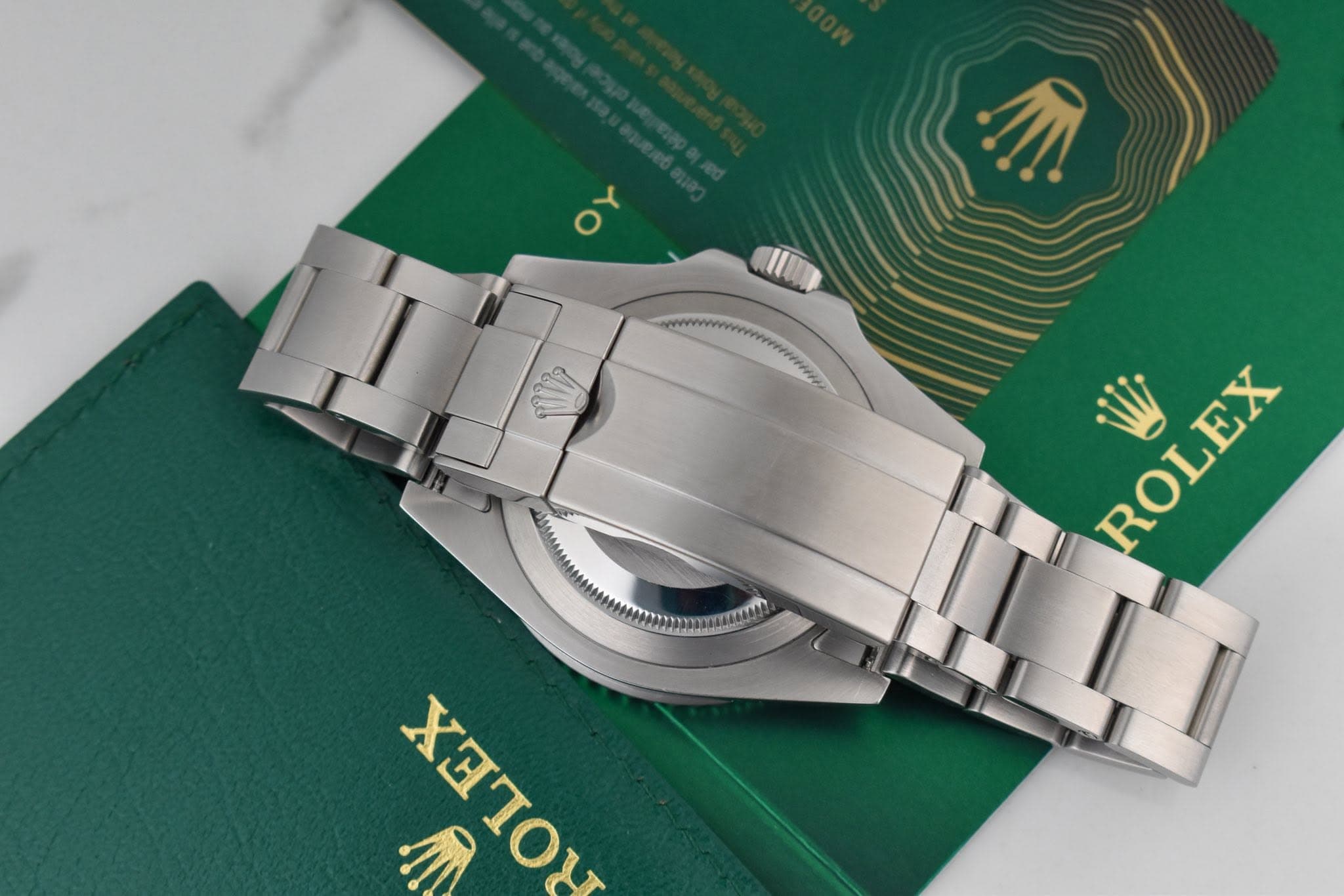 May be an image of wrist watch and text that says 'שי ROLEX ROL ΧΙΟΥ HRTOM لل'