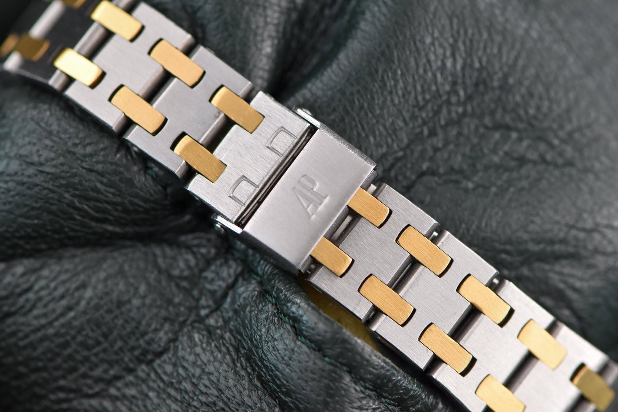 May be an image of digital watch, leather and text