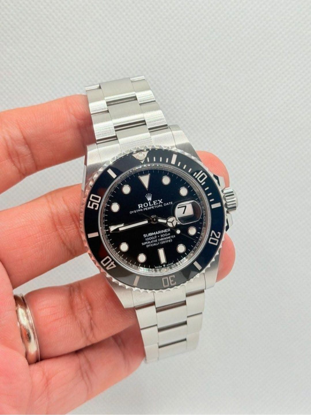 May be an image of wrist watch and text