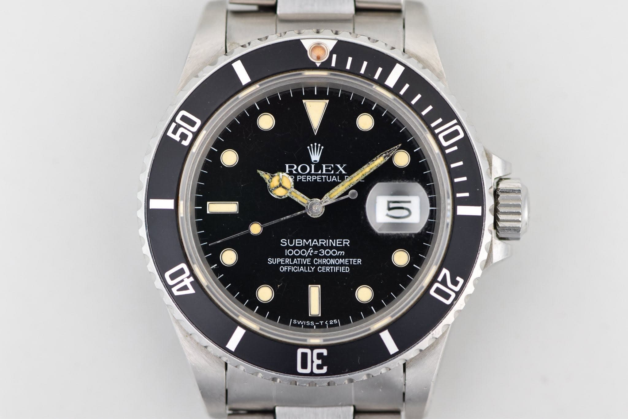 May be an image of wrist watch and text that says '50 ROLEX PERPETUAL 10 JID 5 SUBMARINER 1000ft 1000/t=300m 300m SUPERLATIVE SUPERLATIVECHA CHRONOMETER TER OFFICIALLY…