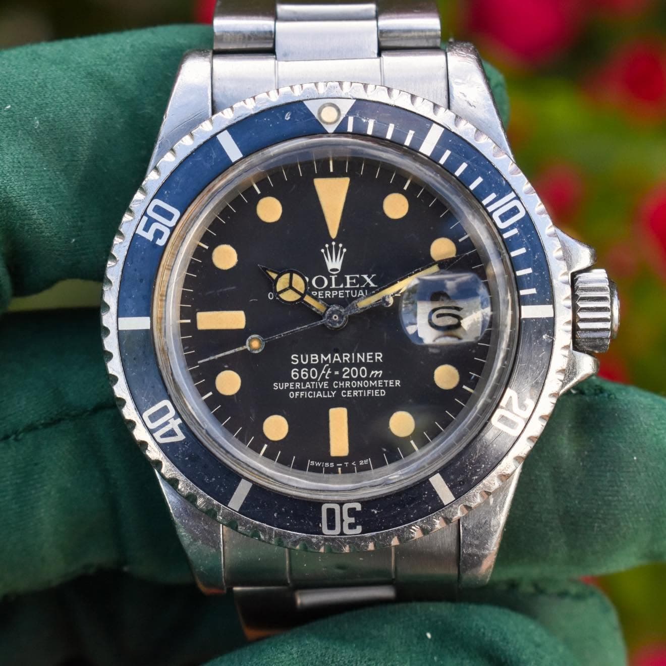 May be an image of wrist watch and text that says '50 10 OLEX PERPETUA! a SUBMARINER INER 660/t 660と-200 -200m SUPERLATIVE REBLATIVE HRONDMETE HRONOMET TER SUPEREIFIALIY…