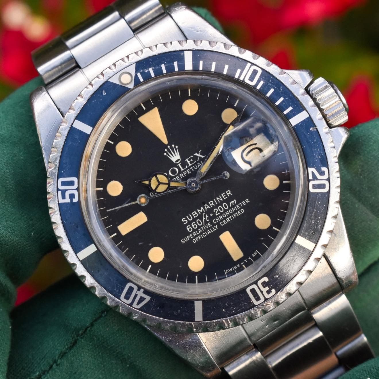 May be an image of wrist watch and text that says '50 6 20 ERPETUAL OLEX ERPET 660/t-200m SUP SUBMARINER 200m :200 660/t CHRONOMETE METER ER 660F CERTISIED CERTIFIED ΣΣ…