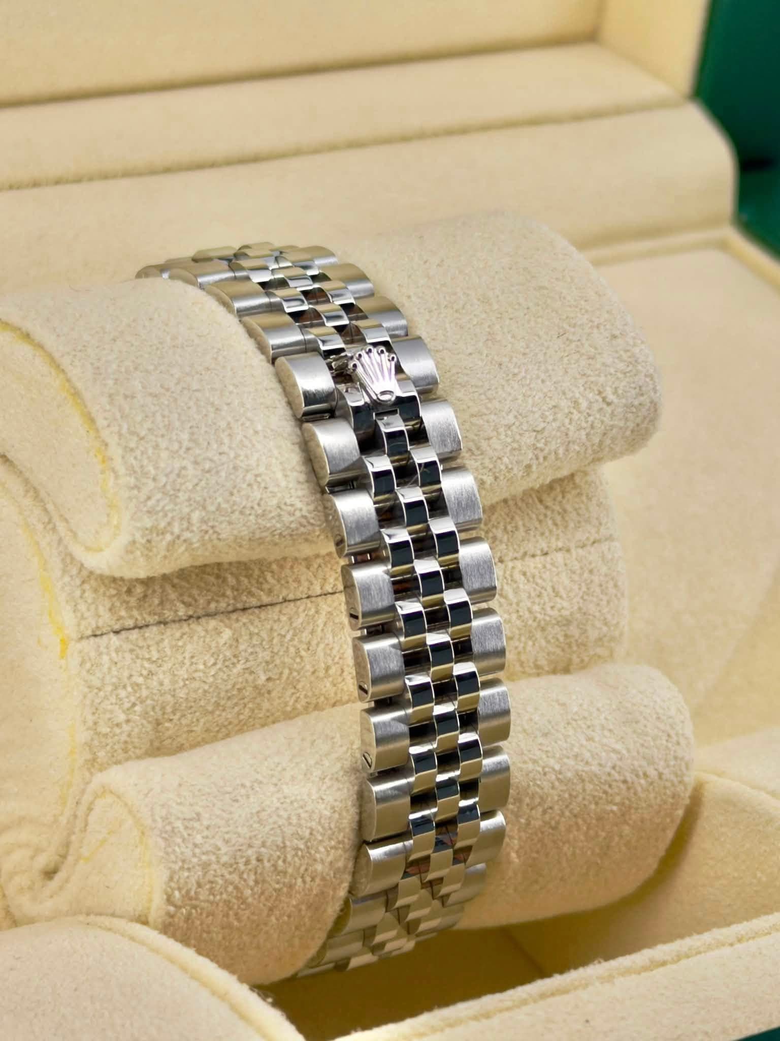 May be an image of wrist watch and jewelry