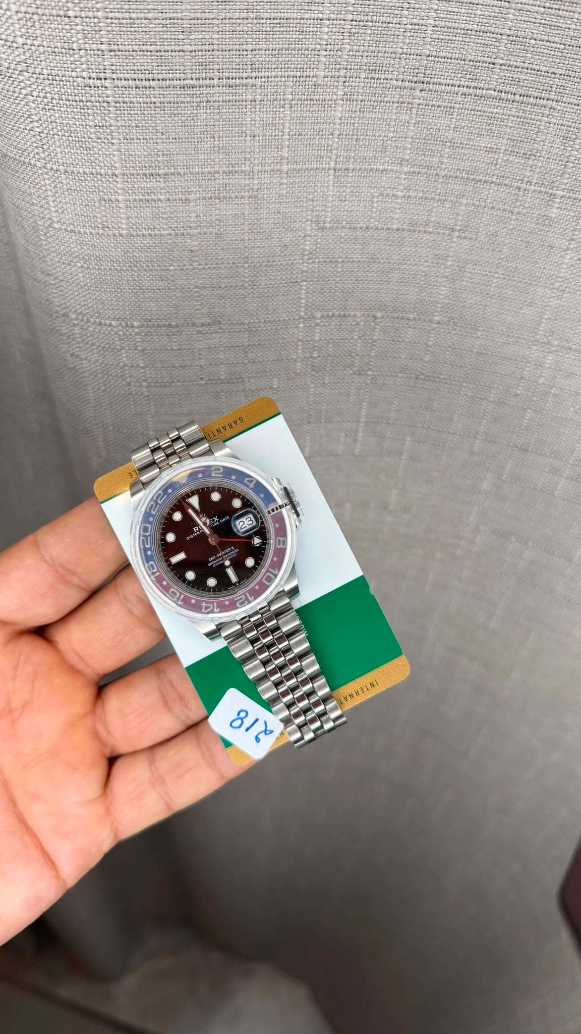 May be an image of wrist watch and text