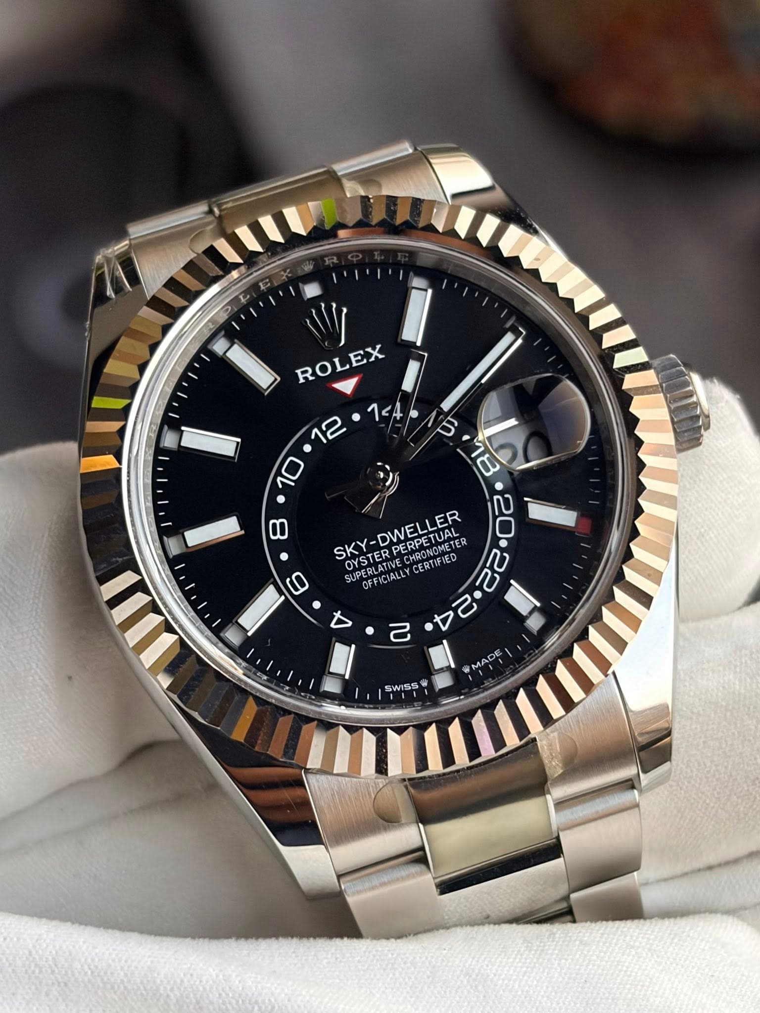 May be an image of wrist watch and text that says 'W ROLEX 8 = • S 10 ש 18 SKY OYSTERPERPETUAL TUAL METER UAL OYSTE PERPE OYSTER SKY-DWELLER CMOONGN OY OFFICIAL DEFICIALLY…