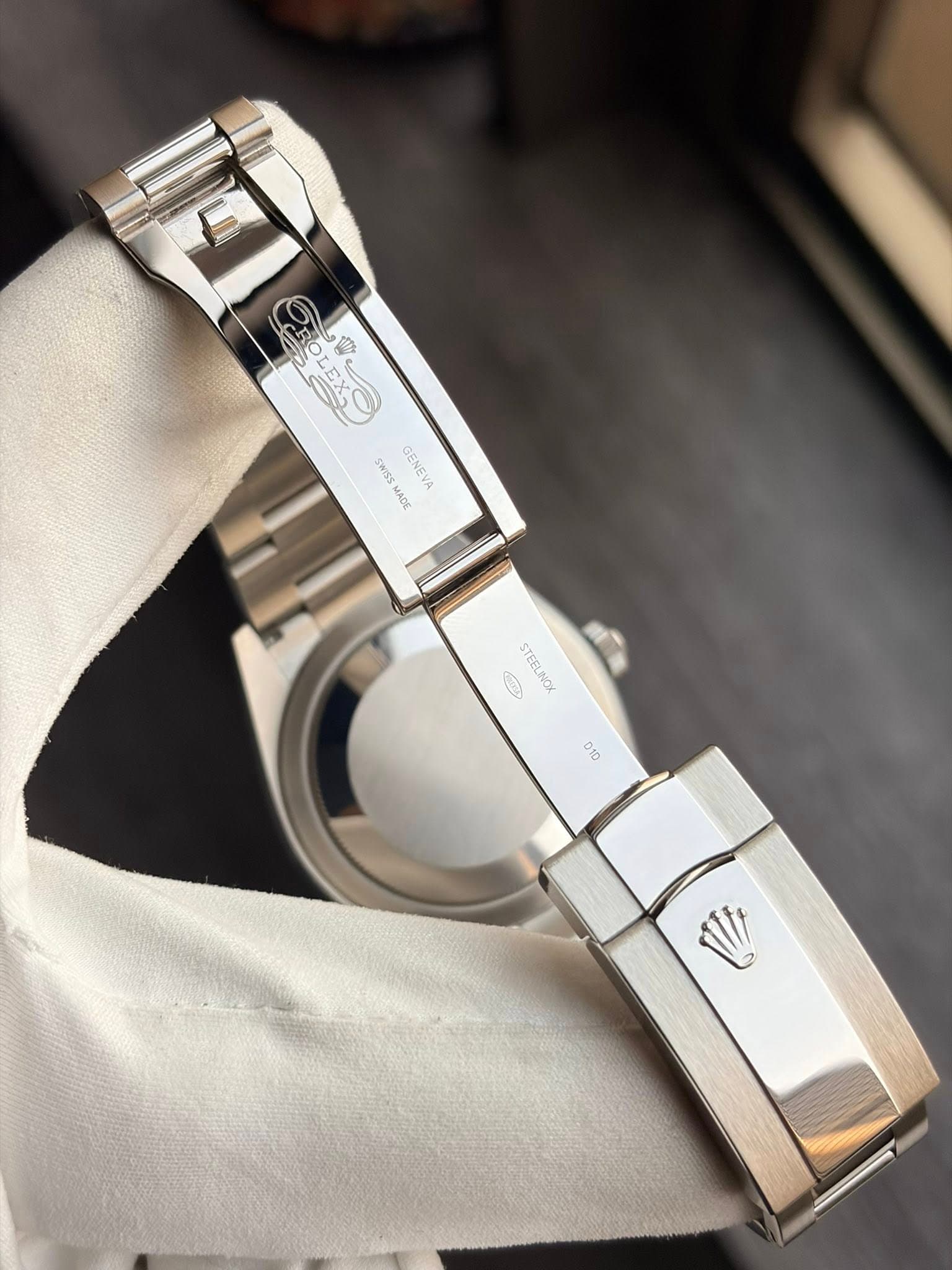 May be an image of wrist watch and text