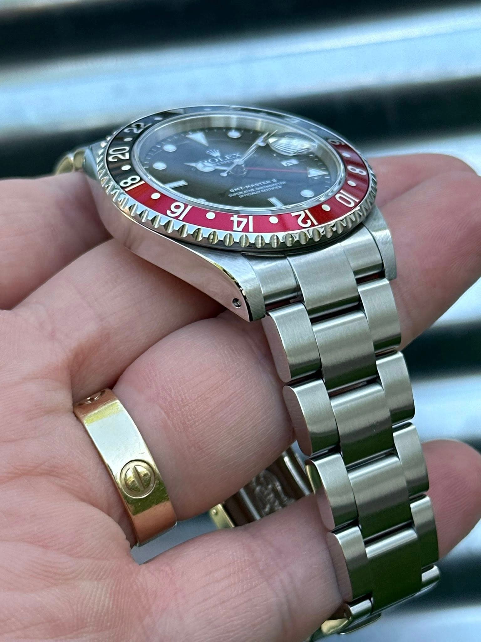 May be an image of wrist watch and text