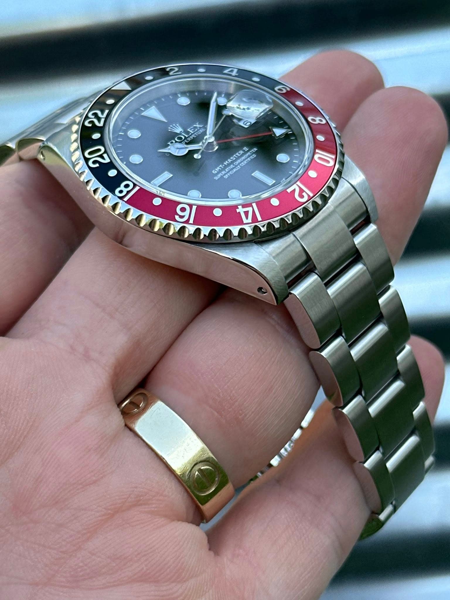 May be an image of wrist watch and text