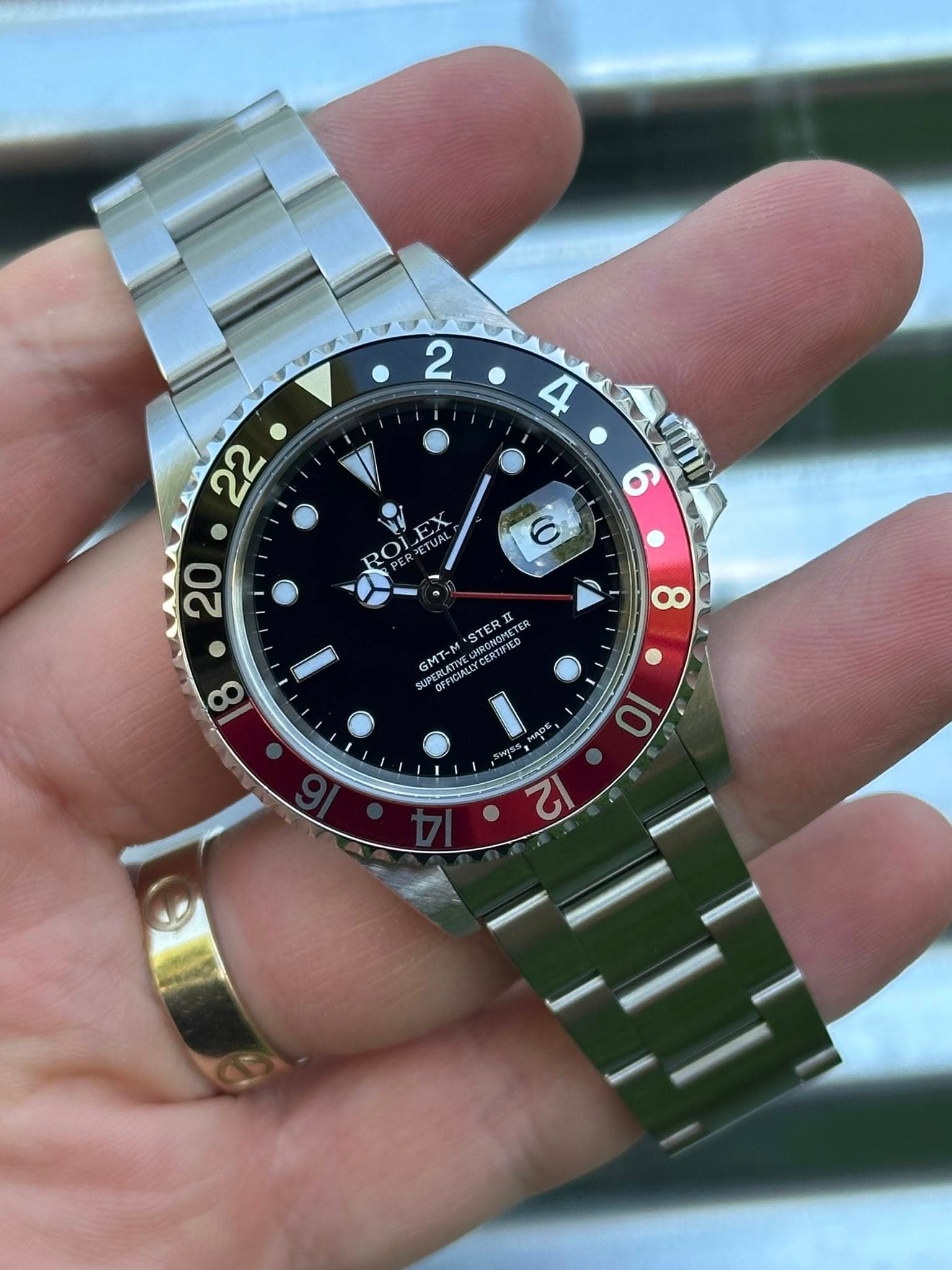 May be an image of wrist watch and text