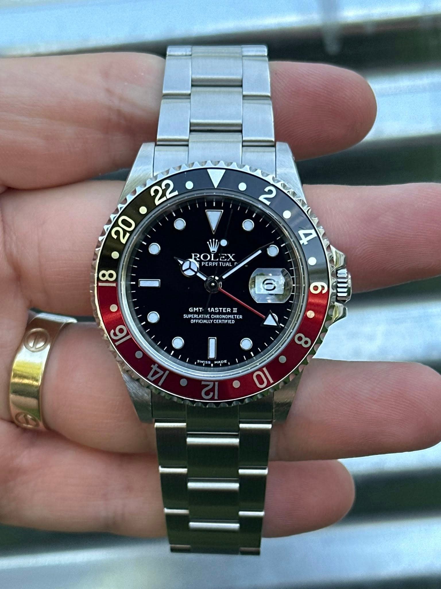 May be an image of wrist watch and text