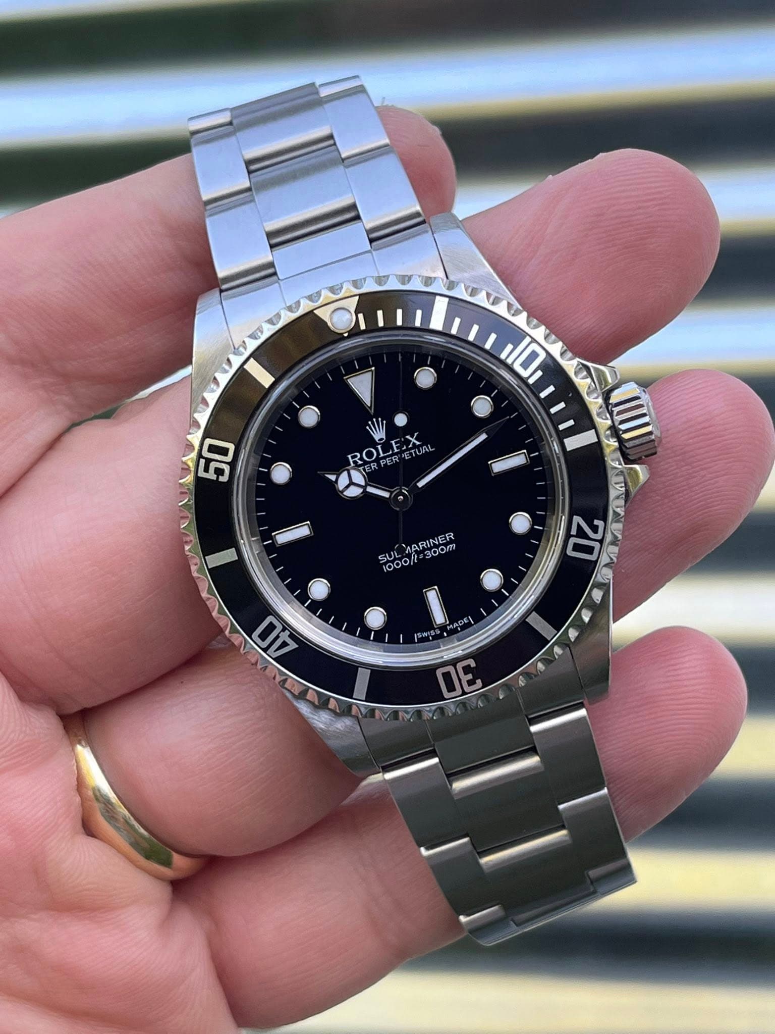 May be an image of wrist watch and text