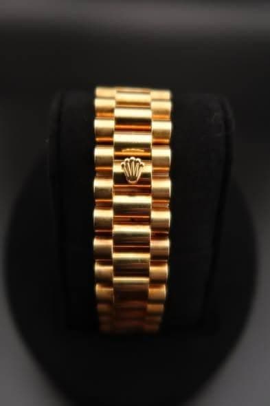 May be an image of jewelry and wrist watch