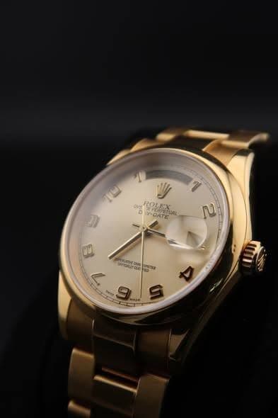 May be an image of wrist watch and text