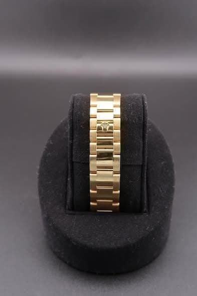 May be an image of wrist watch and jewelry