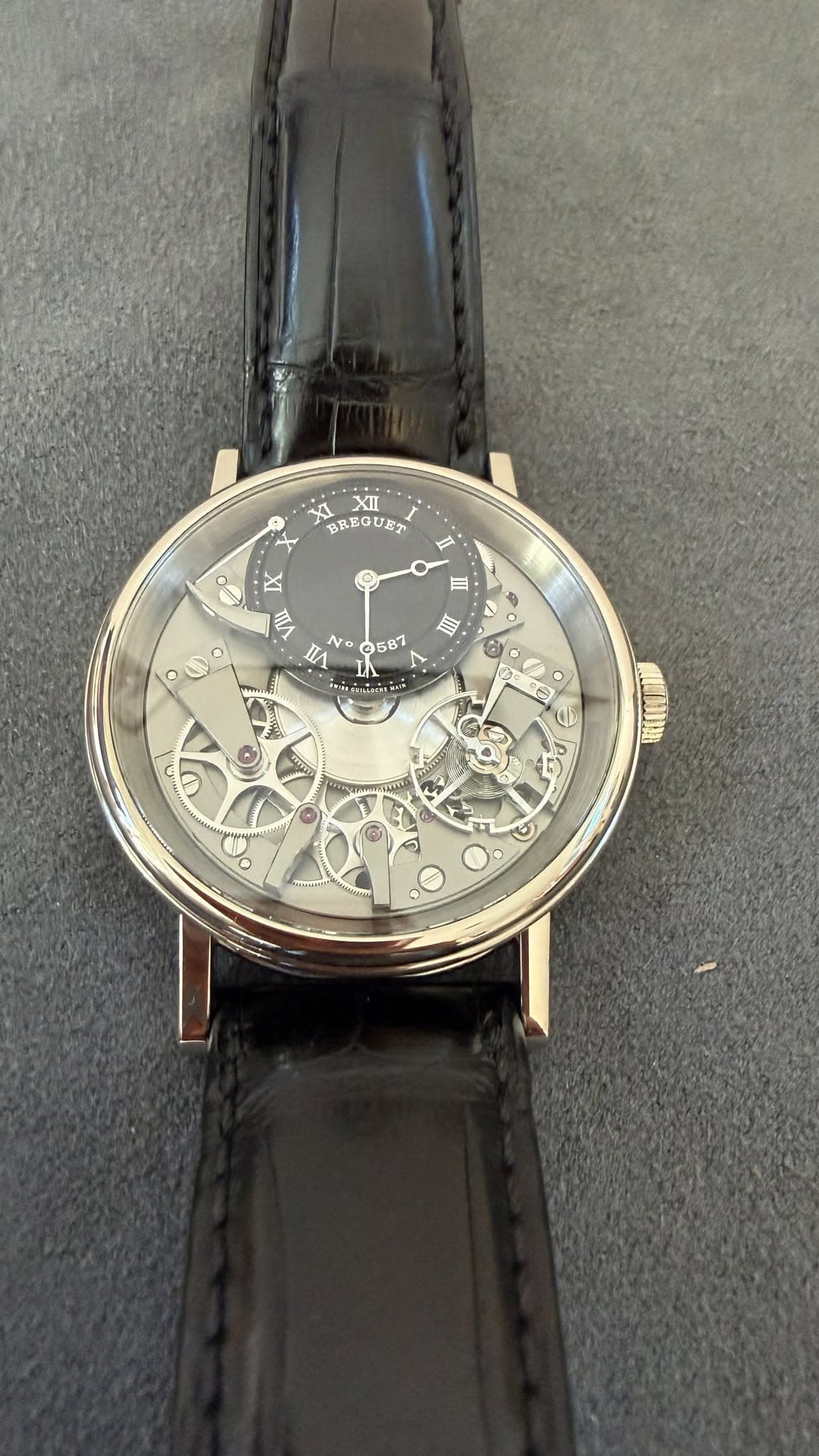 May be an image of wrist watch, leather and text that says 'XI וו BREGUET Ⅱ 스 nA III 0 o III No ©687 л irCnLaa: 0 C 者 C 0'