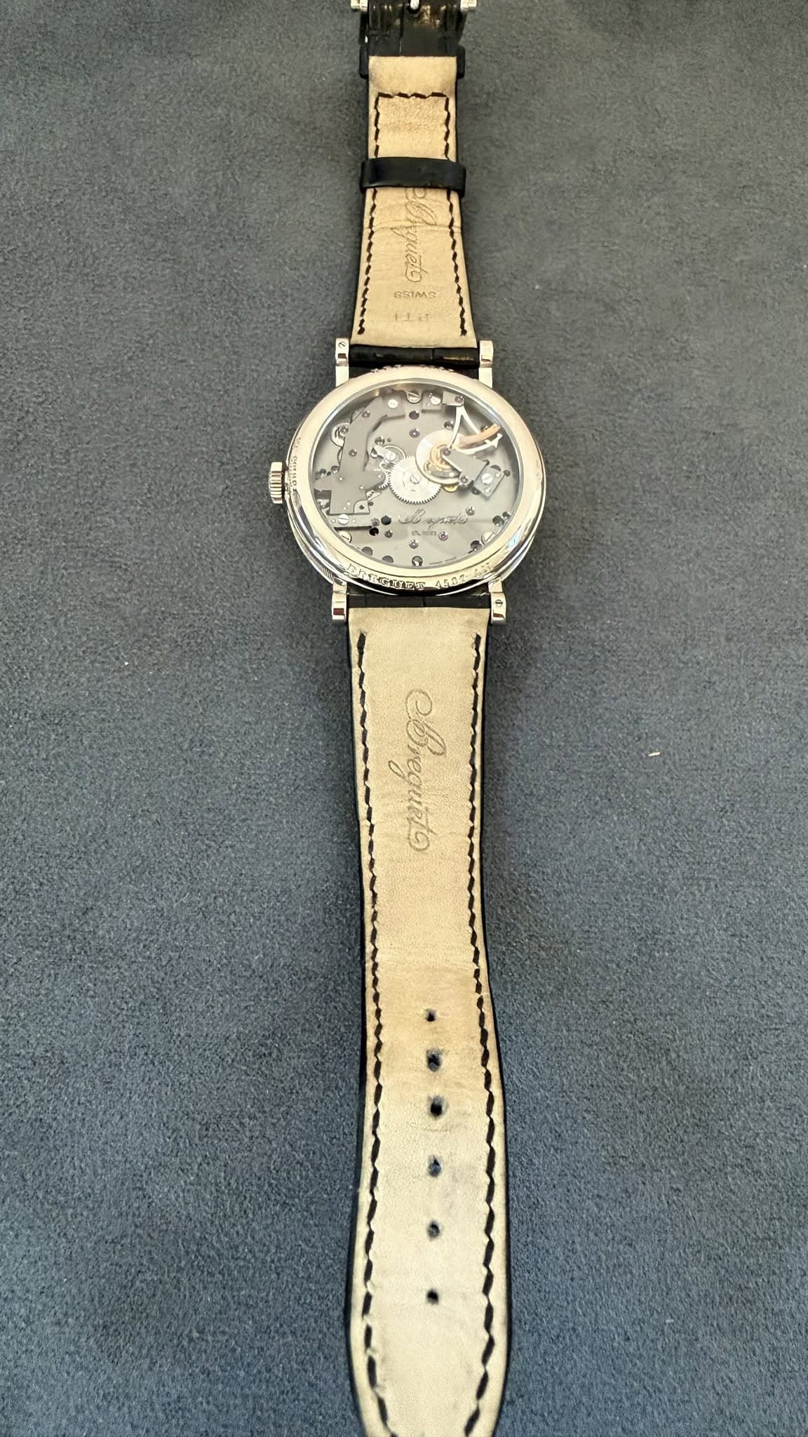 May be an image of wrist watch and leather
