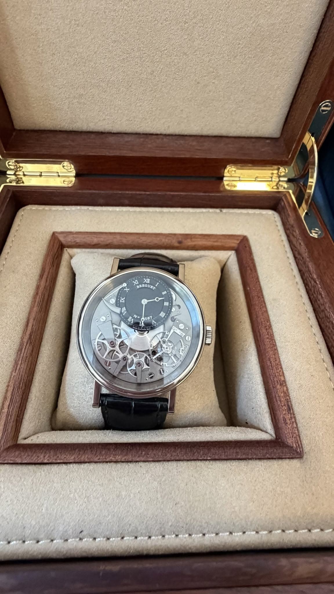 May be an image of wrist watch and text