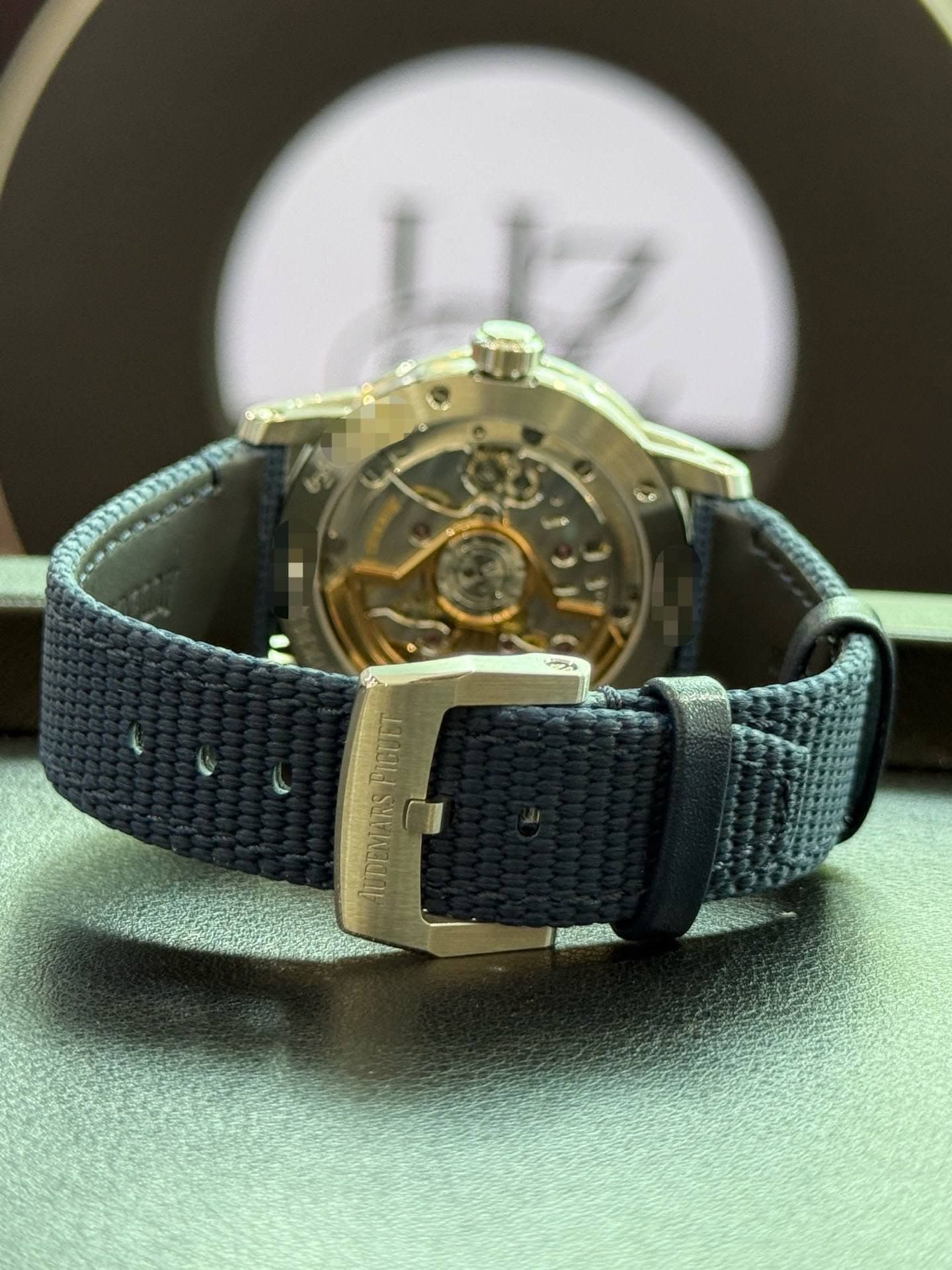 May be an image of wrist watch and text that says 'רשארל' ACDEMARSPIGUET UDEMARS FIGUET'
