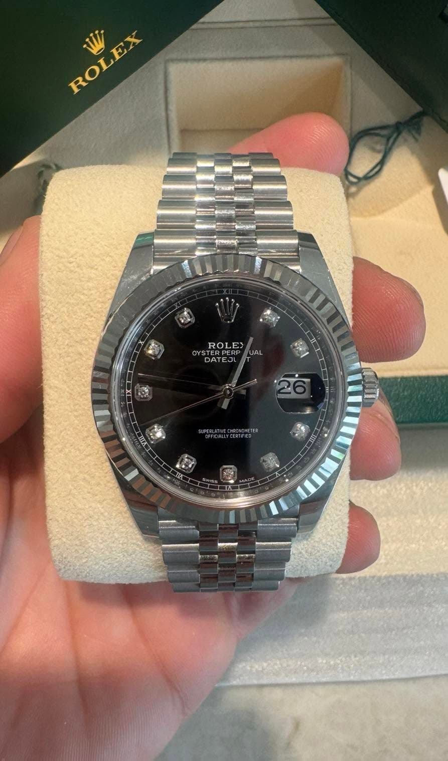 May be an image of wrist watch and text