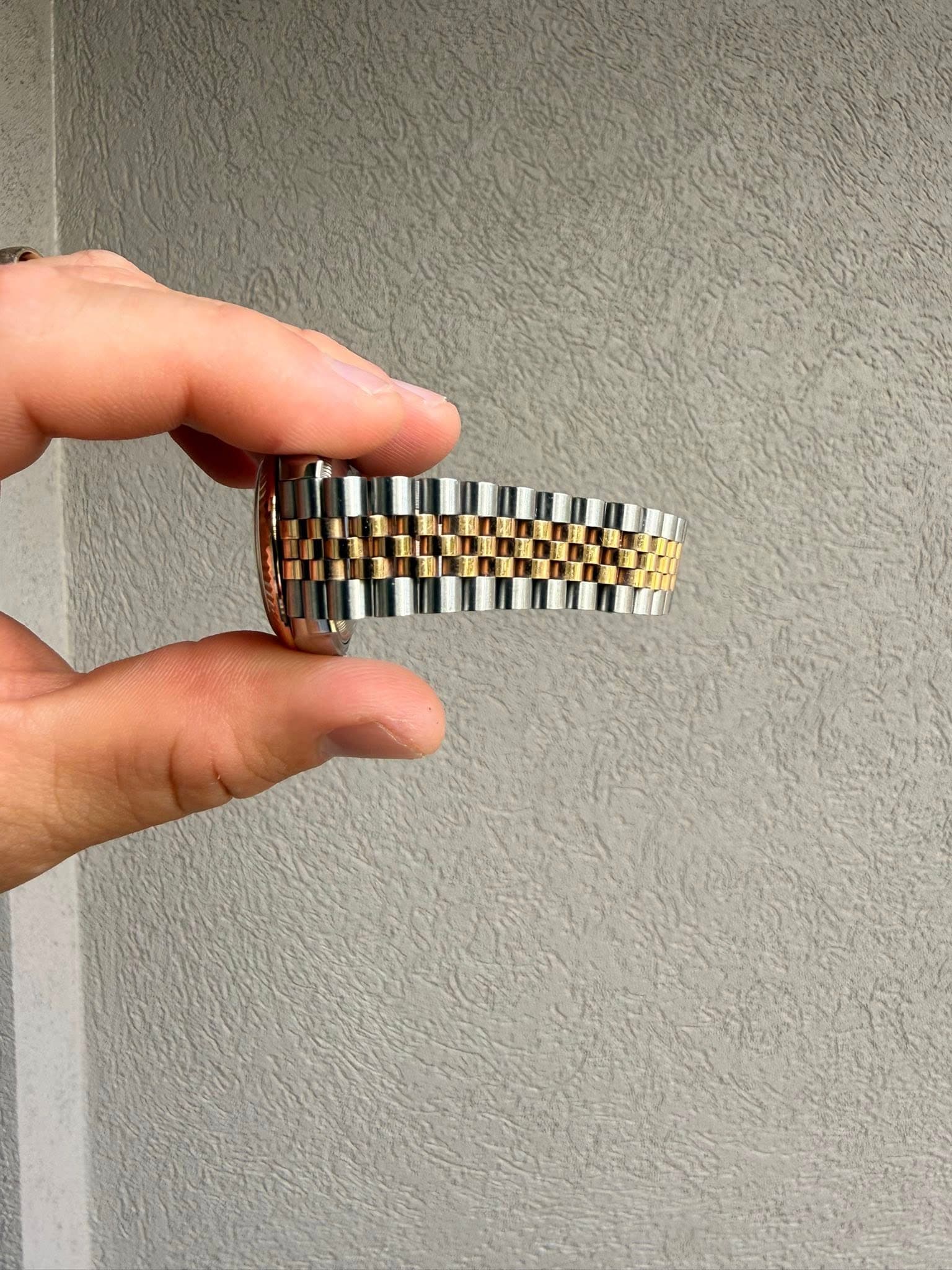 May be an image of wrist watch