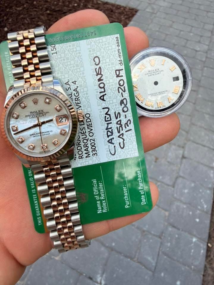 May be an image of wrist watch and text