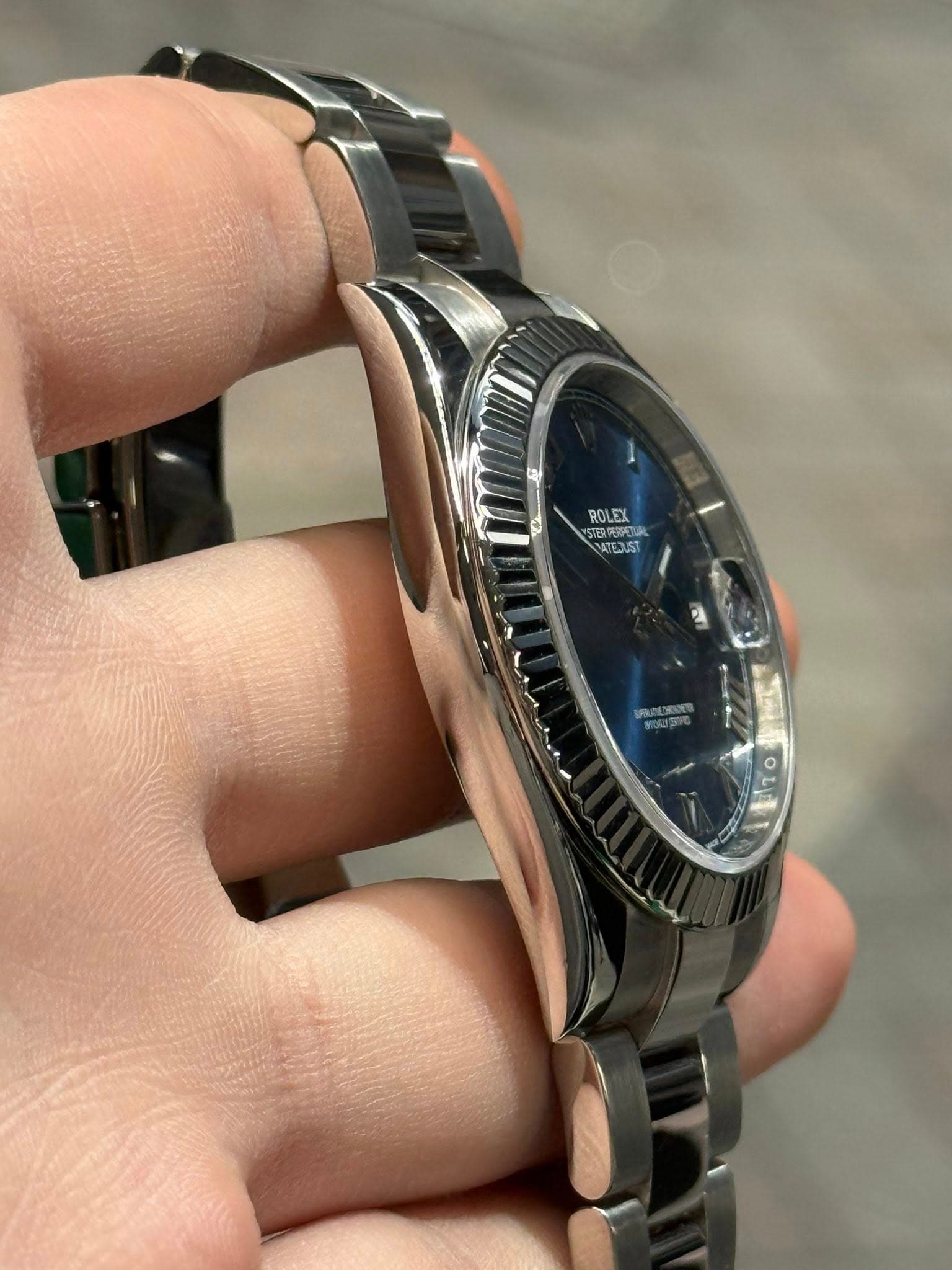 May be an image of wrist watch and text