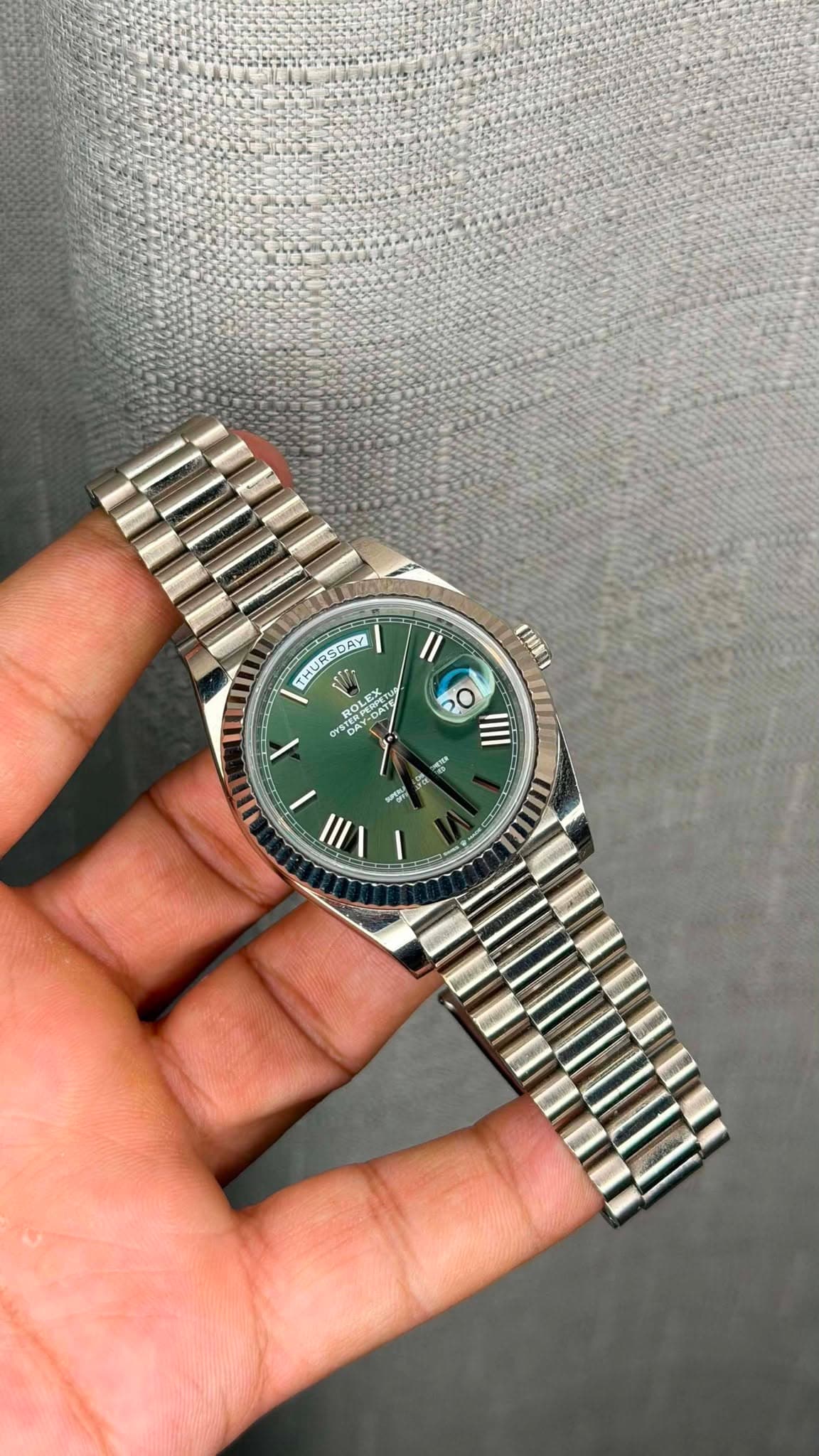 May be an image of wrist watch and text