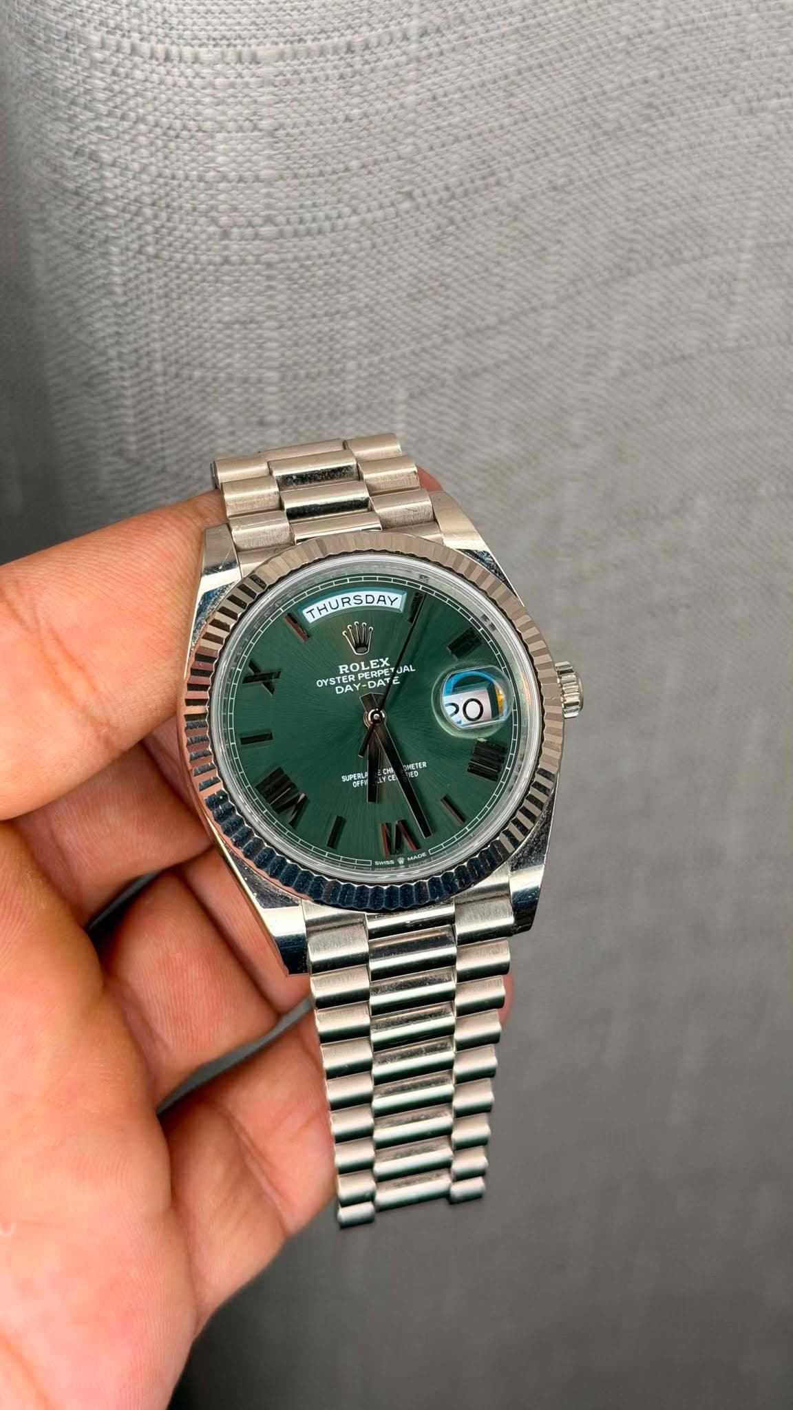 May be an image of wrist watch and text