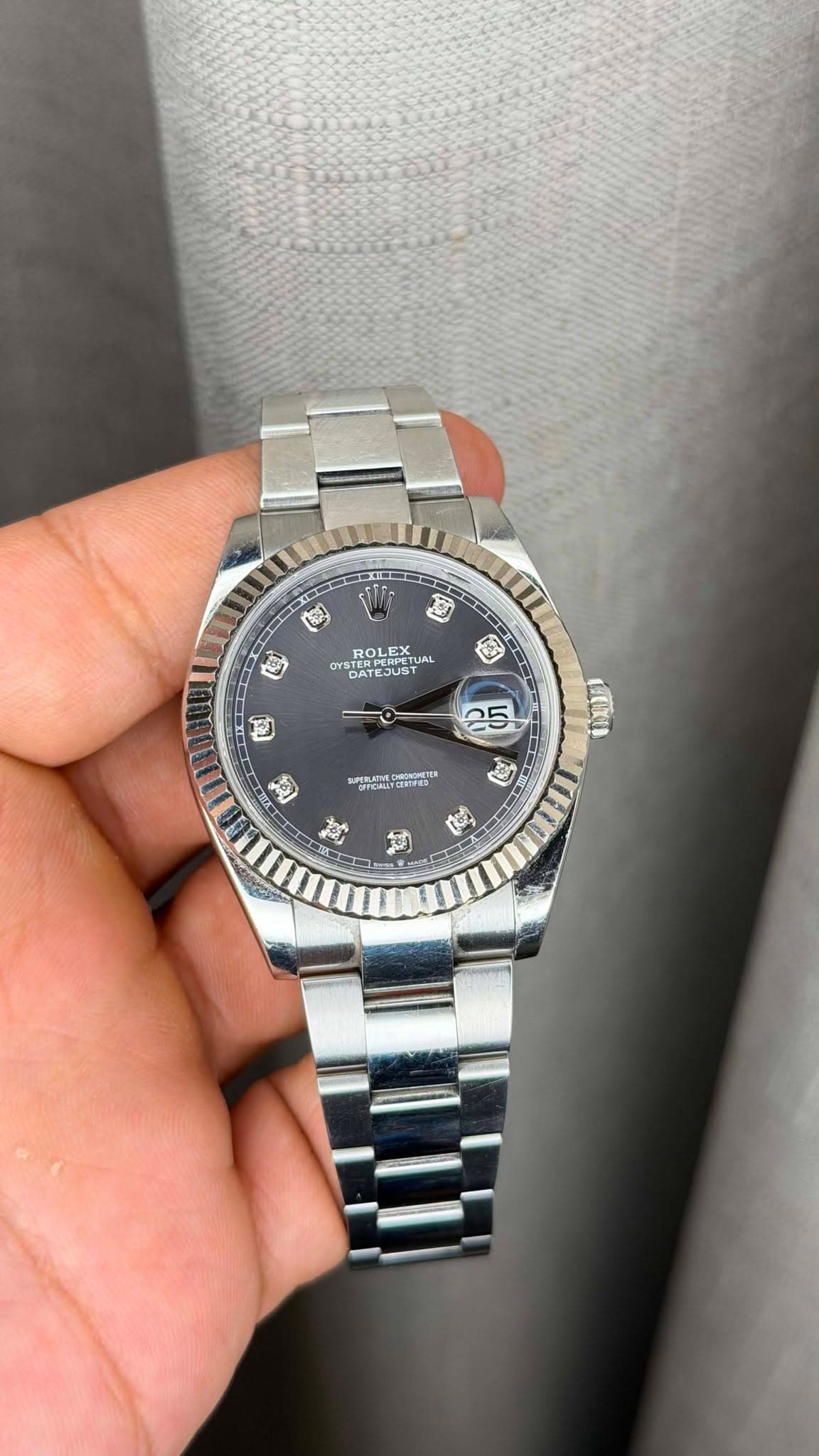 May be an image of wrist watch and text