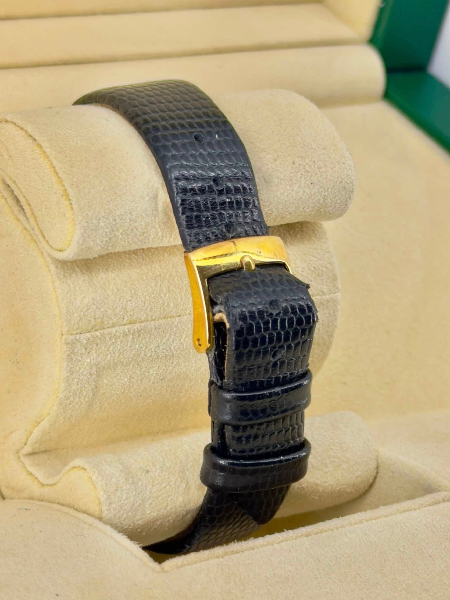 May be an image of wrist watch and jewelry