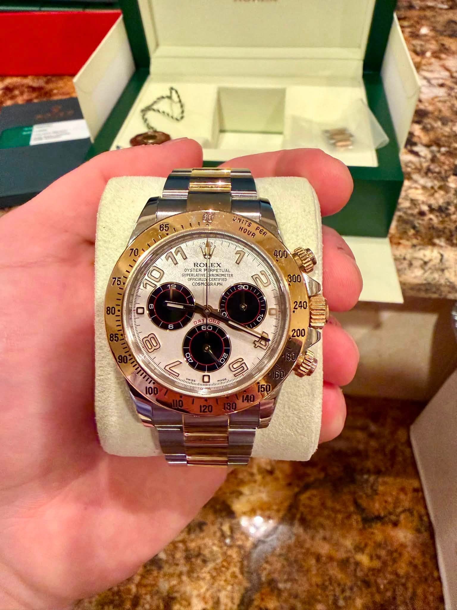 May be an image of wrist watch and text