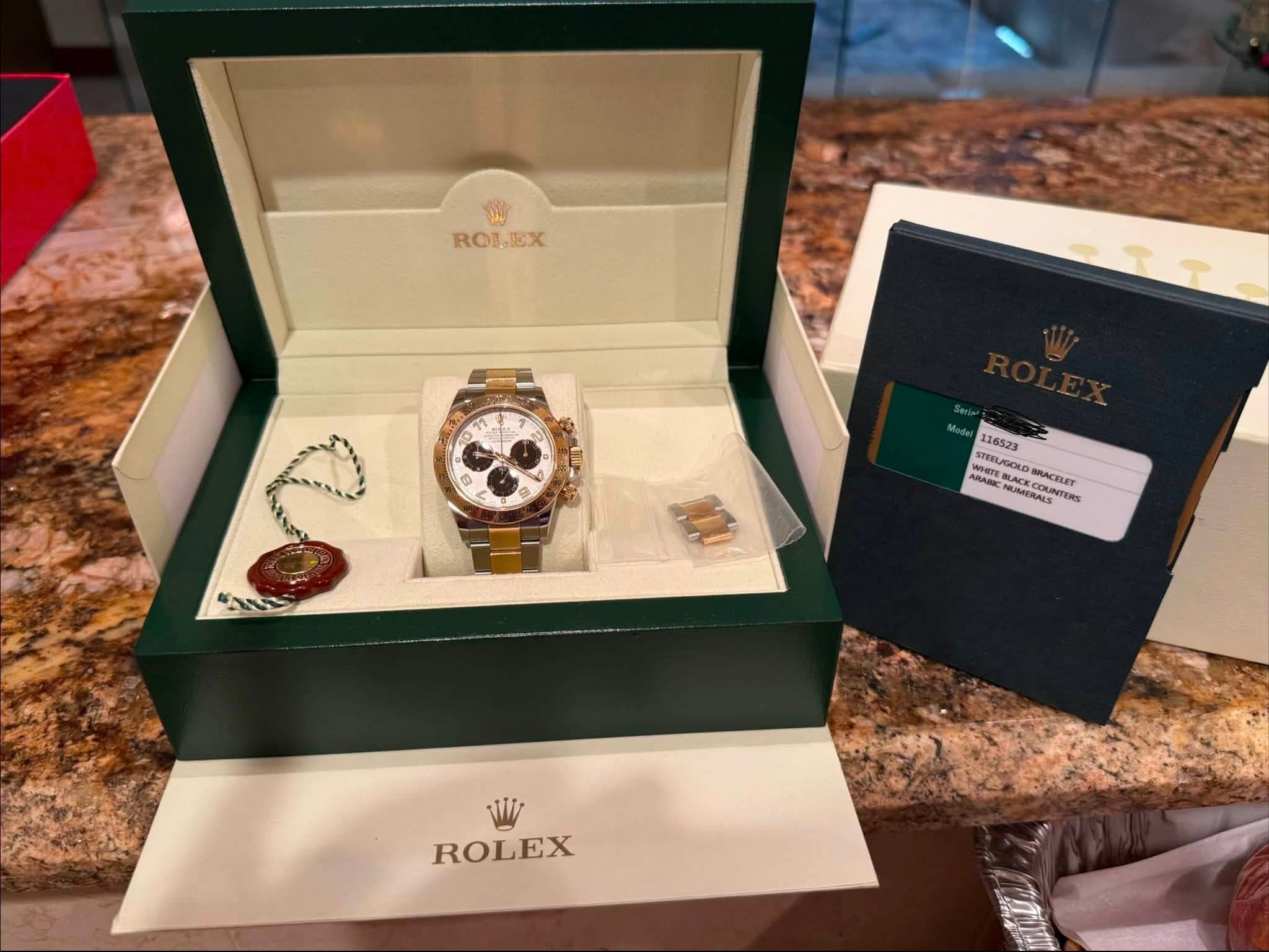 May be an image of wrist watch and text