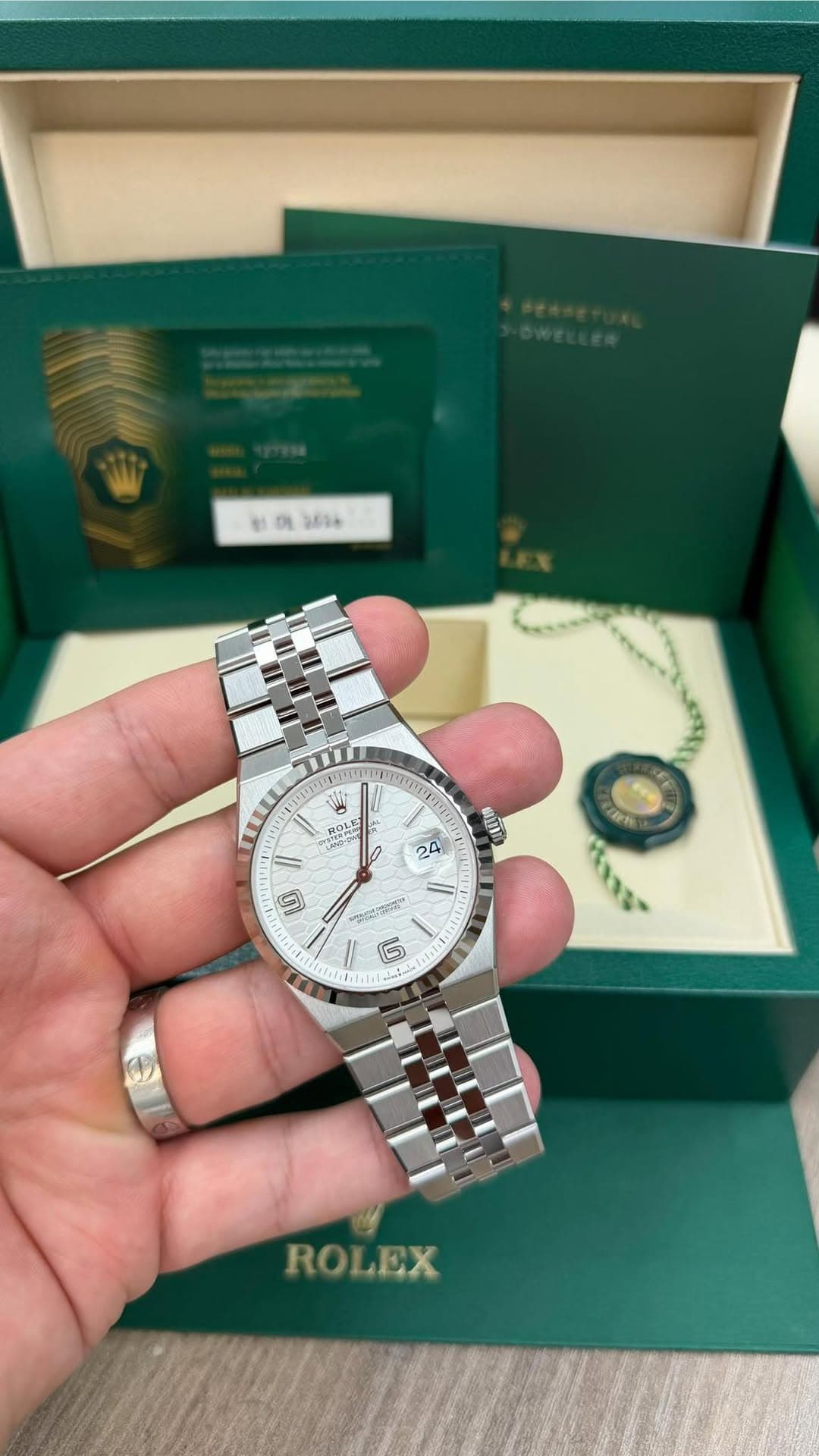 May be an image of wrist watch and text