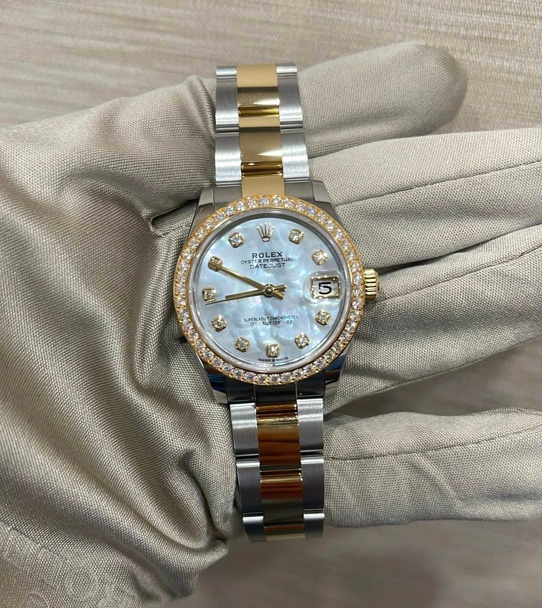 May be an image of wrist watch and text