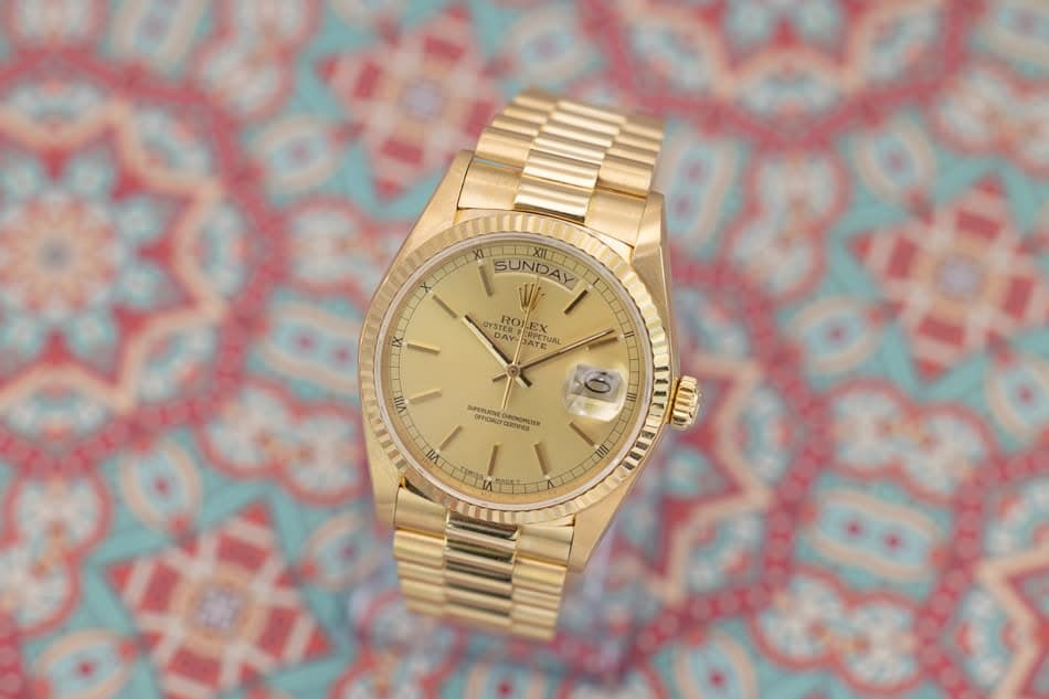 May be an image of wrist watch and text