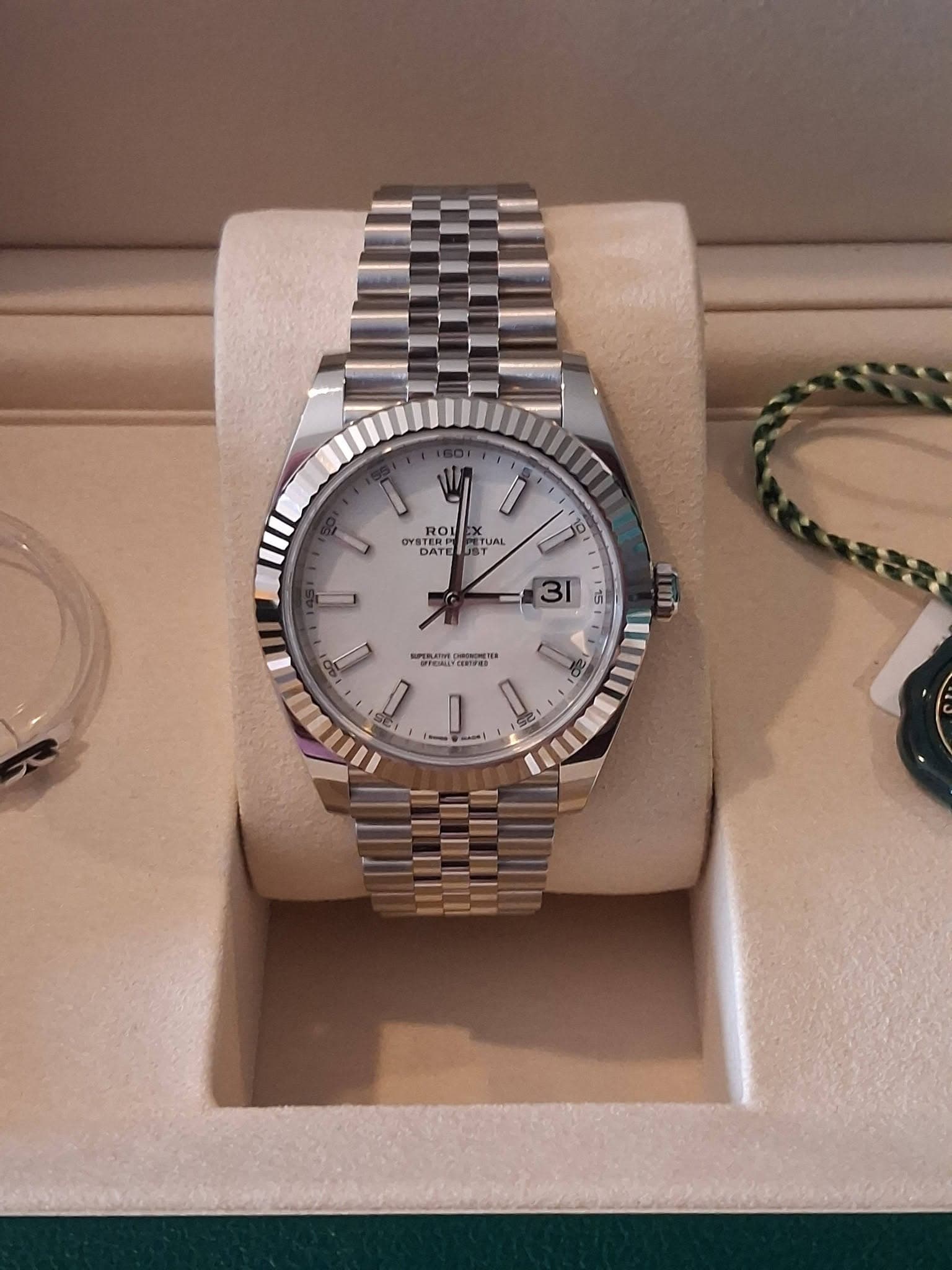 May be an image of wrist watch and text
