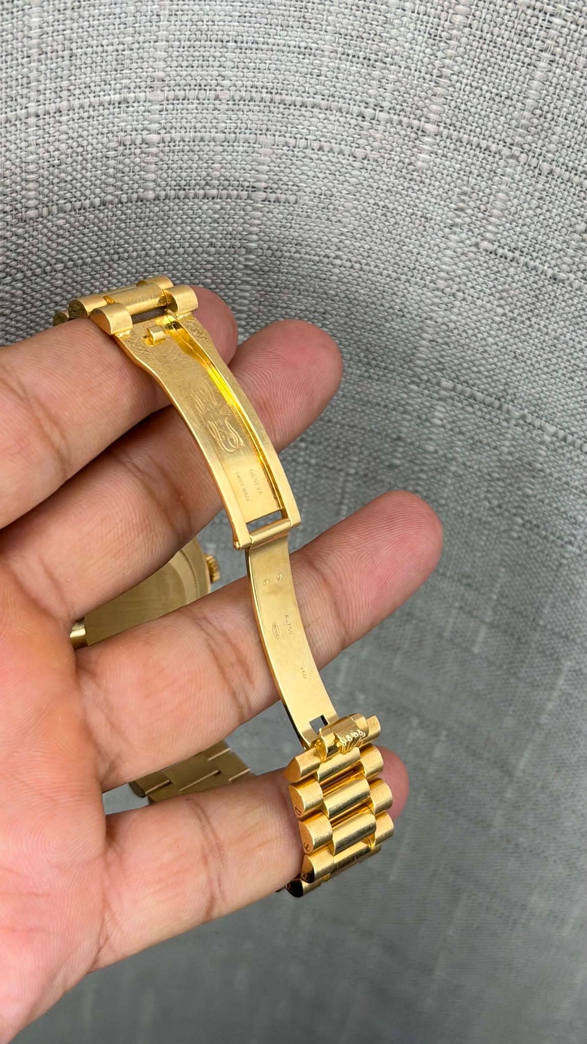 May be an image of wrist watch, jewelry and text