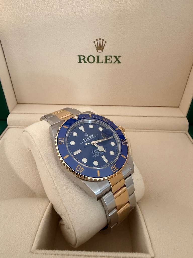 May be an image of wrist watch and text that says 'ROLEX 50 RoL ROLEX PESIPETUAL EX O 20 I GUBAY 4התמת S 23 / 40 30'