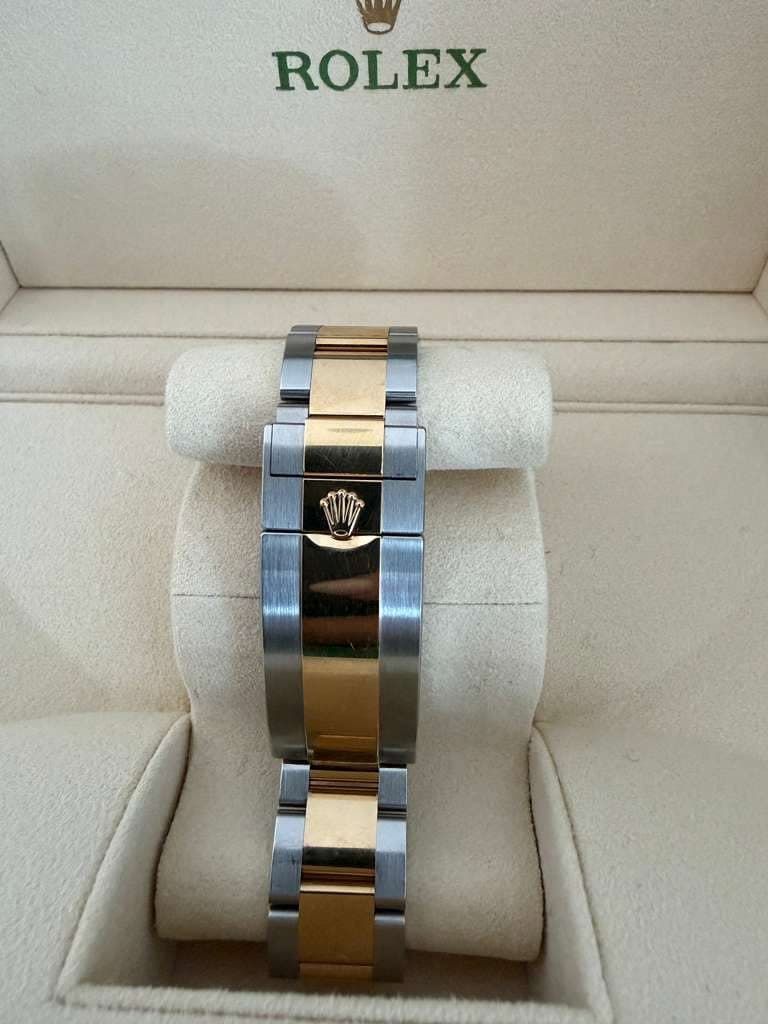 May be an image of wrist watch and text that says 'ROLEX'