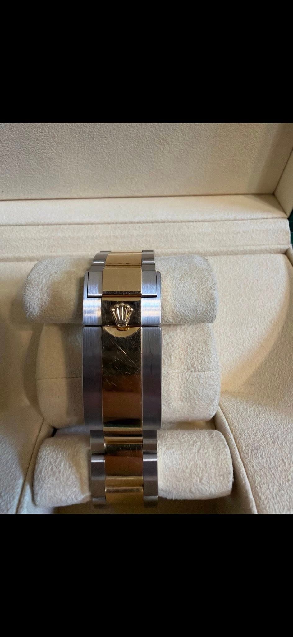 May be an image of wrist watch and ring