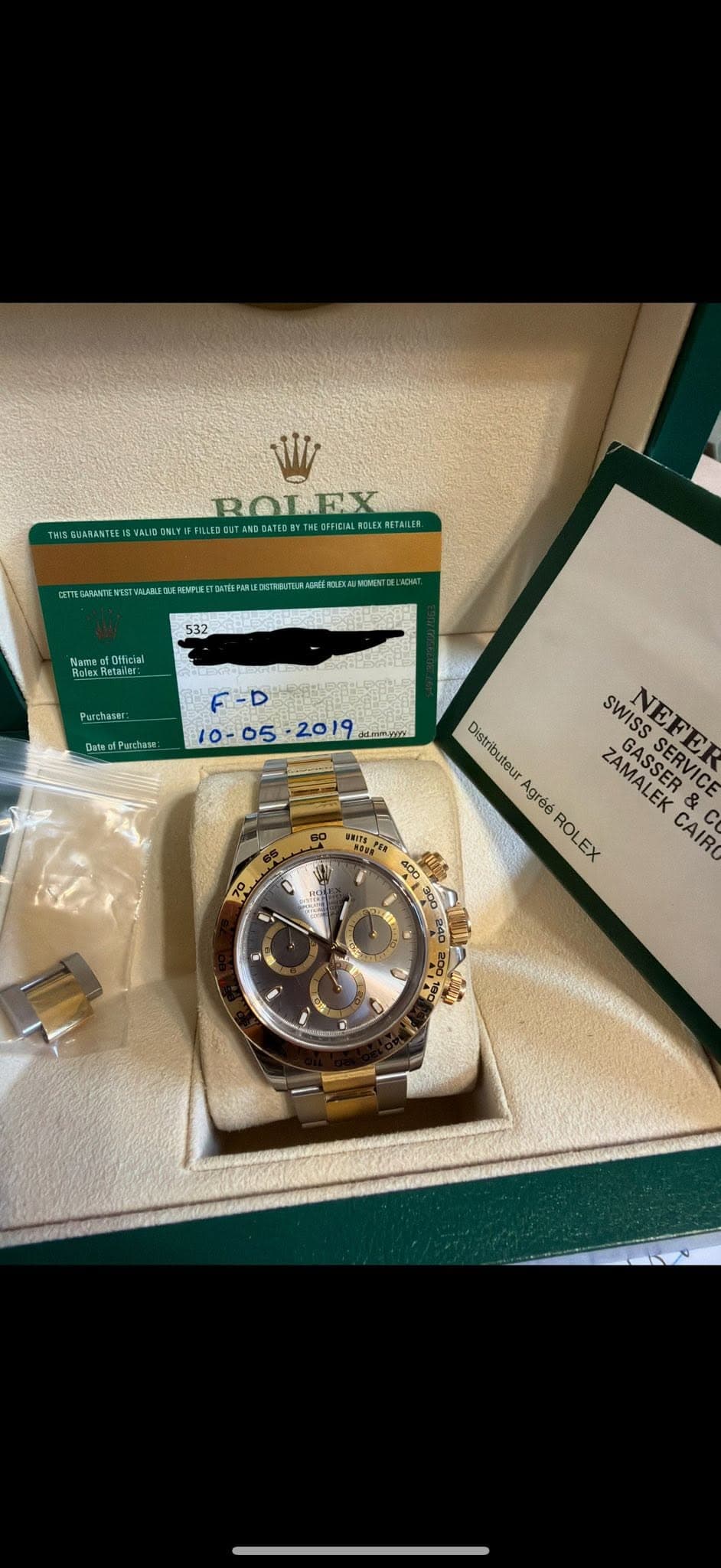 May be an image of wrist watch and text