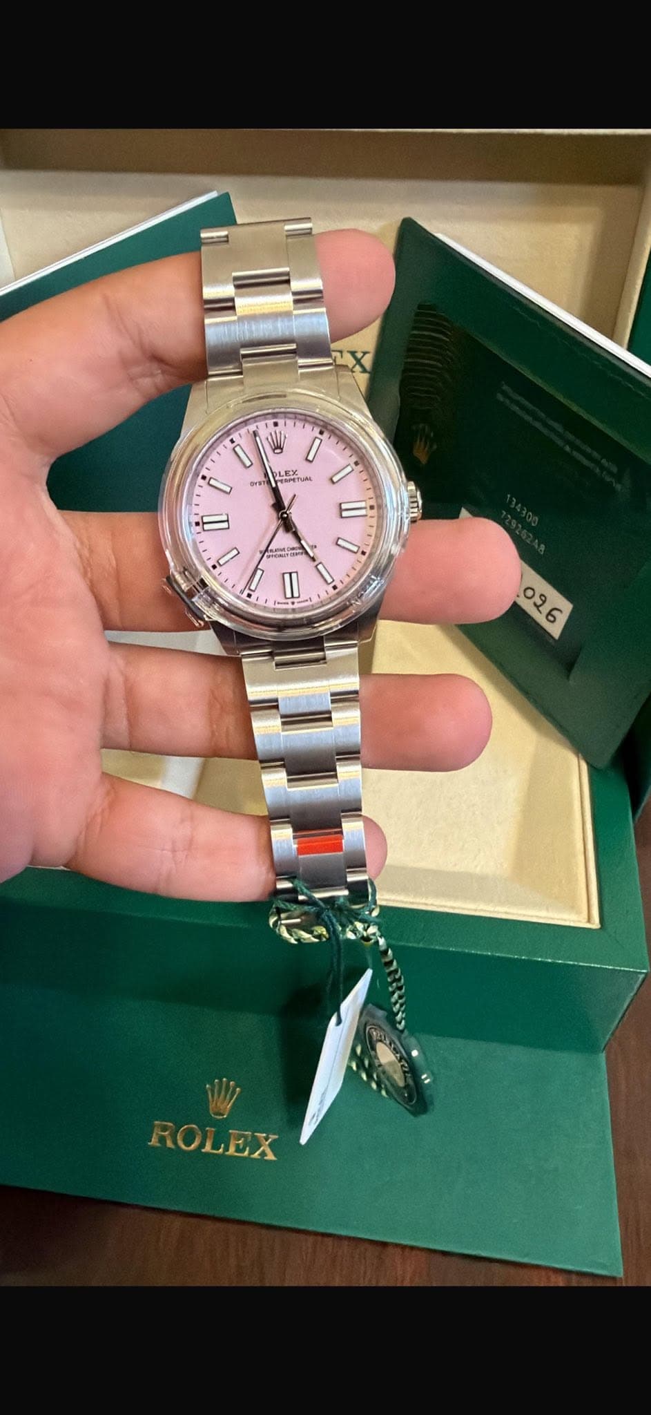 May be an image of wrist watch and text